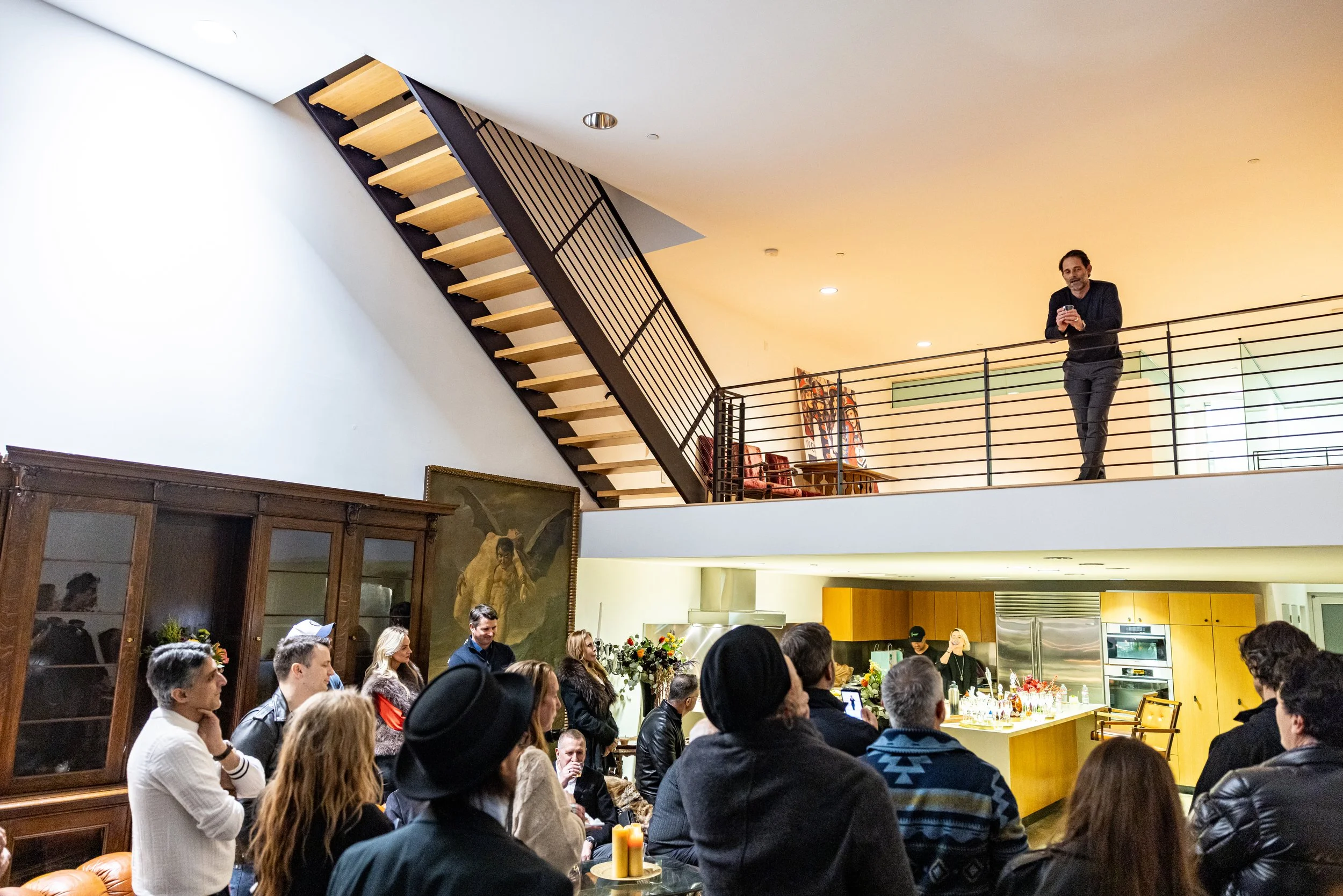 Open-concept kitchen and floating staircase at The Lofts Venice Beach event