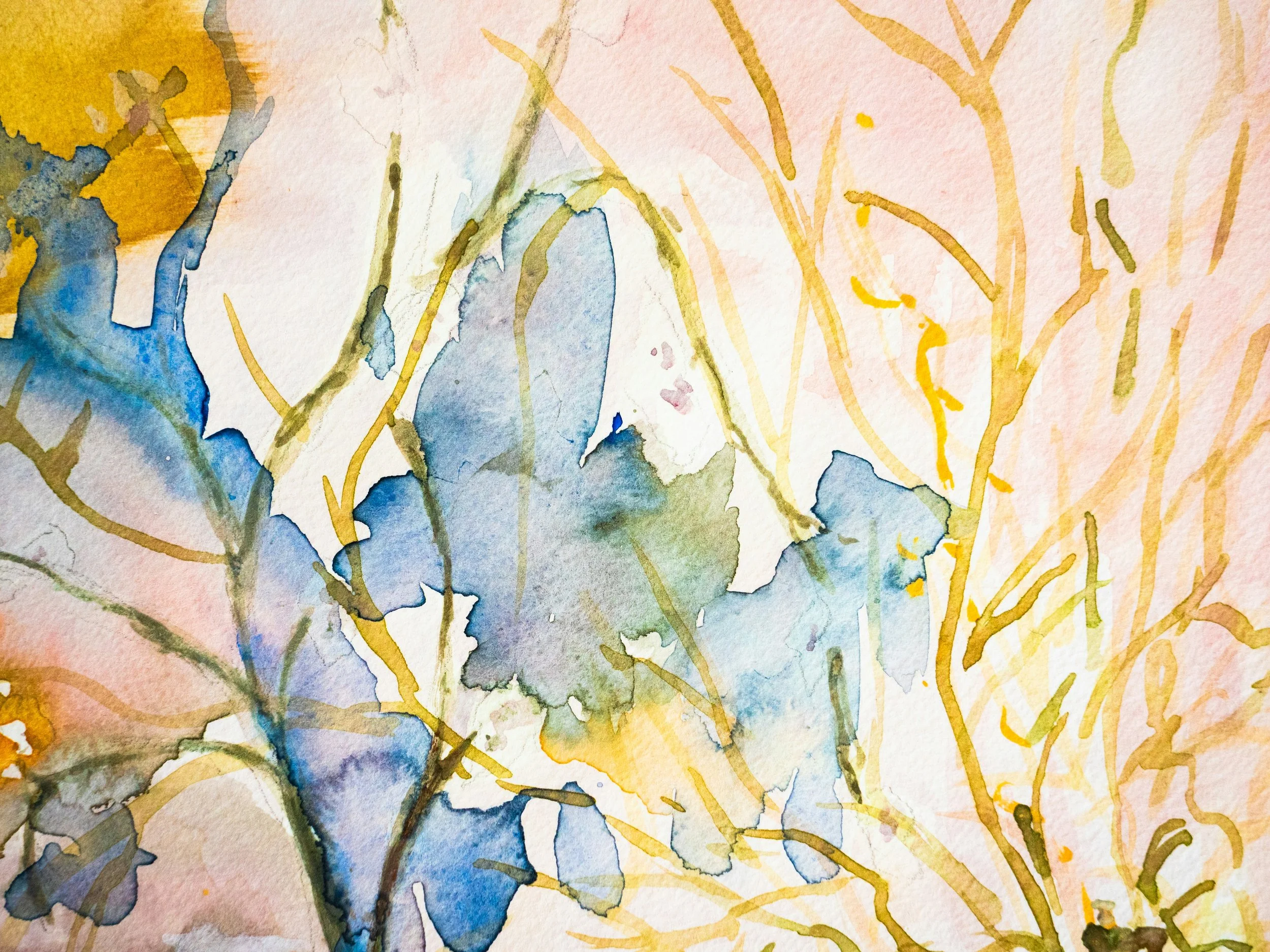 Abstract watercolor artwork featuring soft blue floral shapes and flowing yellow organic lines