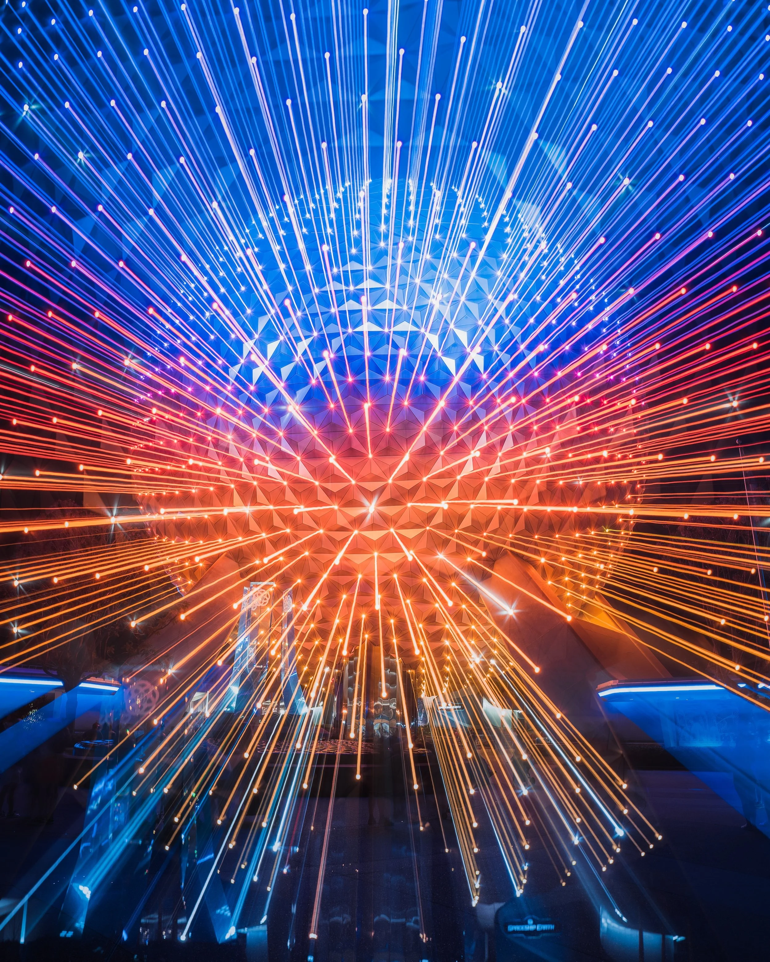Photo of colorful laser lights created inside a futuristic or technological setting.