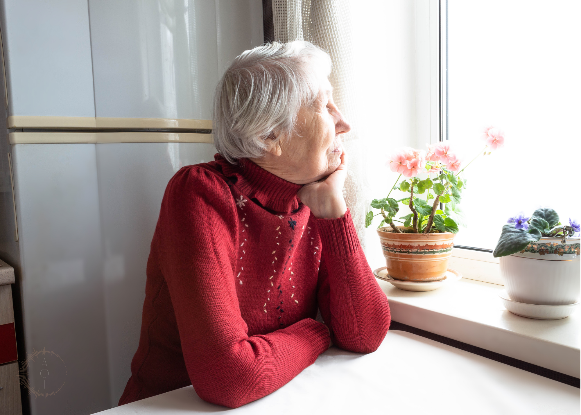 Older adult woman sitting at a window, resting her chin on her hand, looking outside quietly, soft natural light.