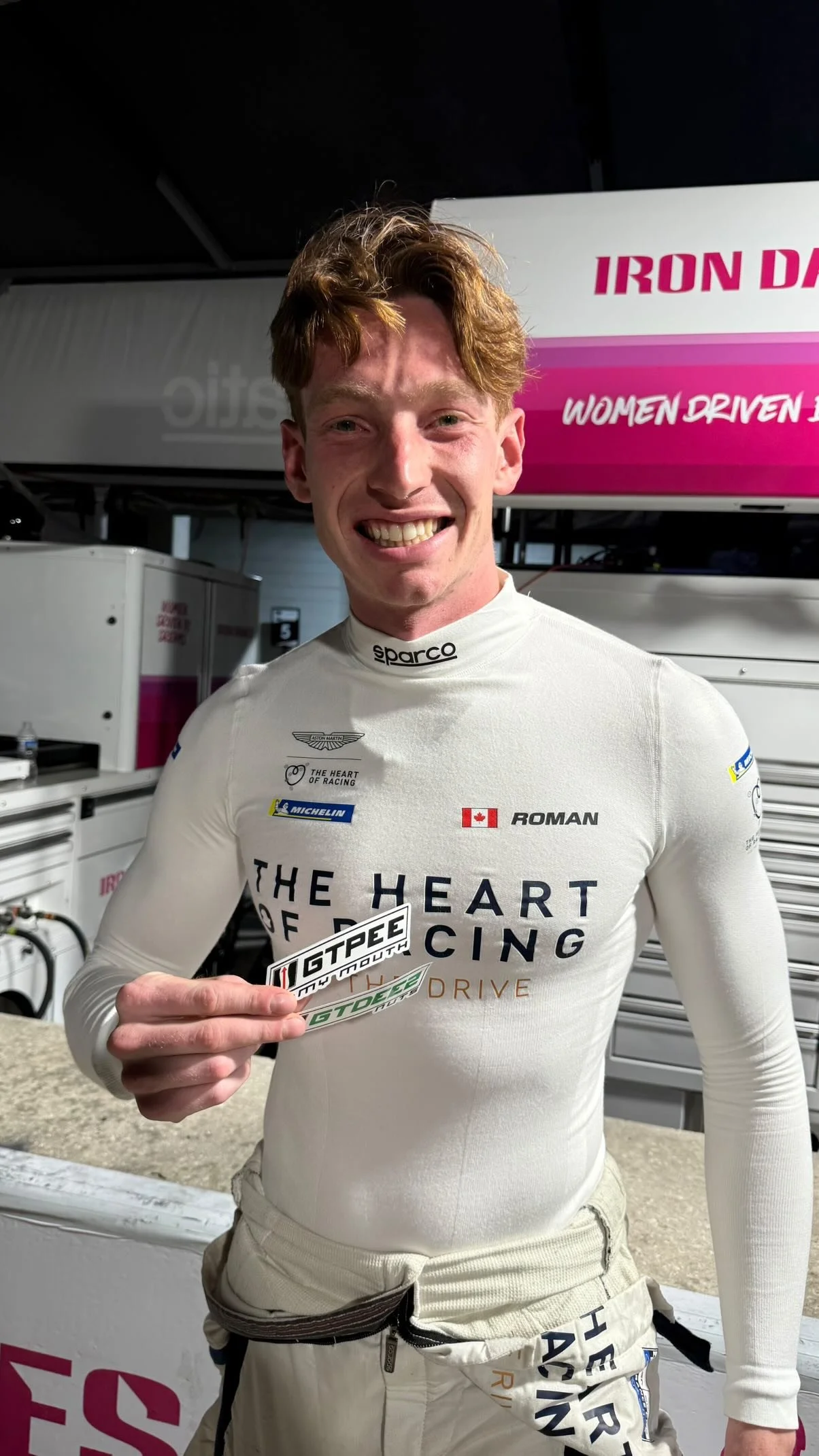 A Driver holding one of our stickers