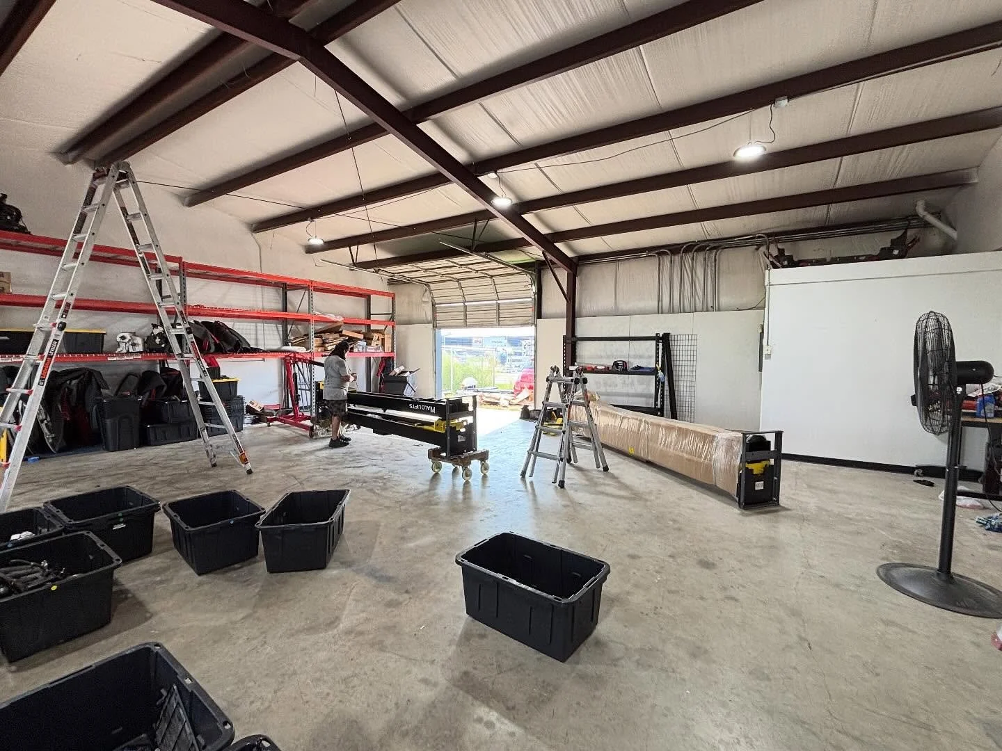 The fun begins! Two 2 post lifts are now in place.