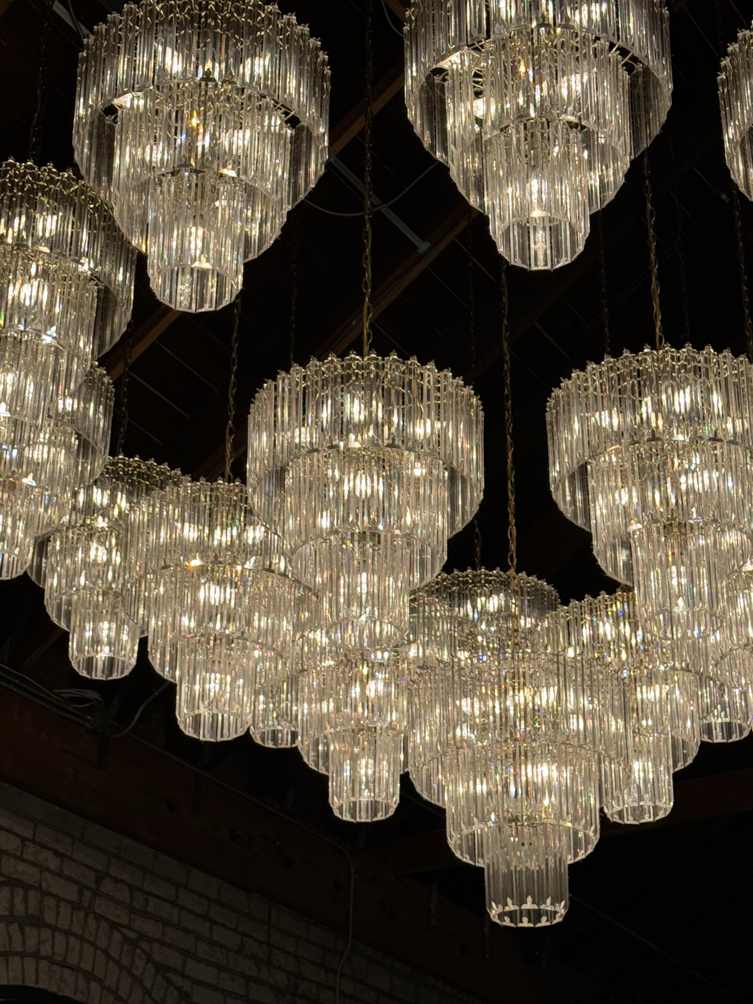 Elegant chandelier lighting setup for corporate event led by Brisbane Corporate MC