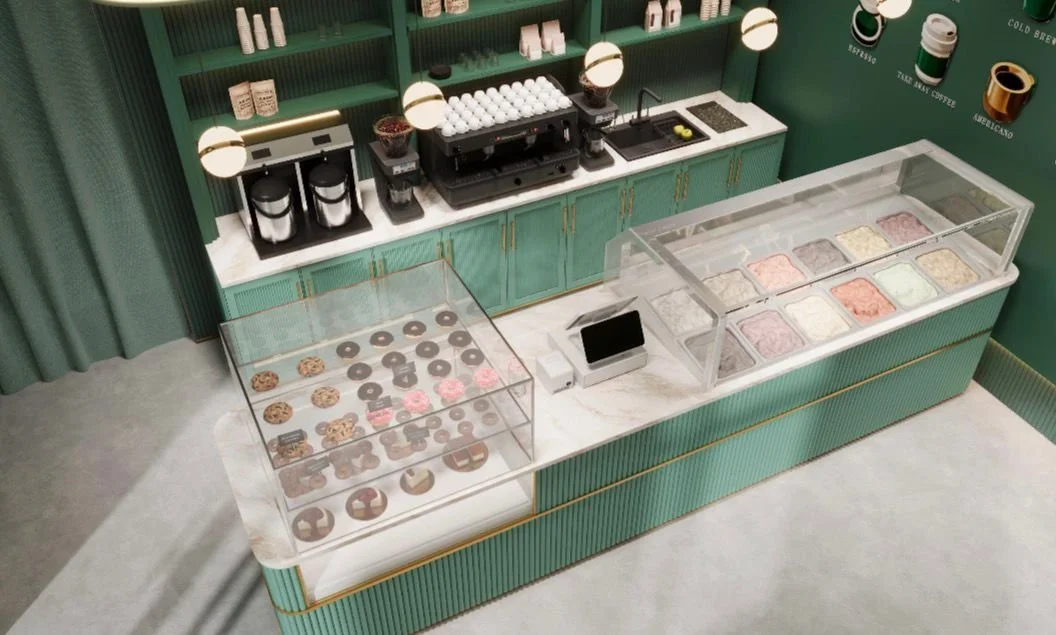 A modern ice cream shop with a green and white counter displaying various flavors of ice cream in a glass case, along with a section for baked goods like cookies and donuts, and a coffee making station in the background.