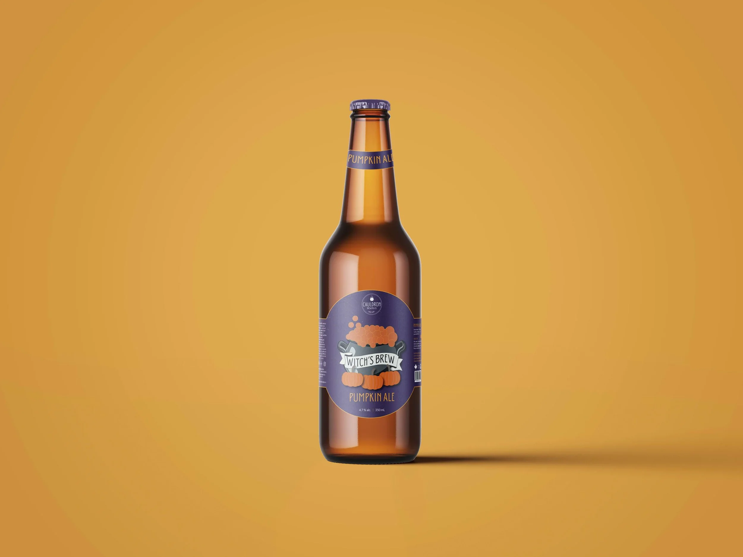 Amber beer bottle labeled as a pumpkin ale, shown upright against a solid orange background.