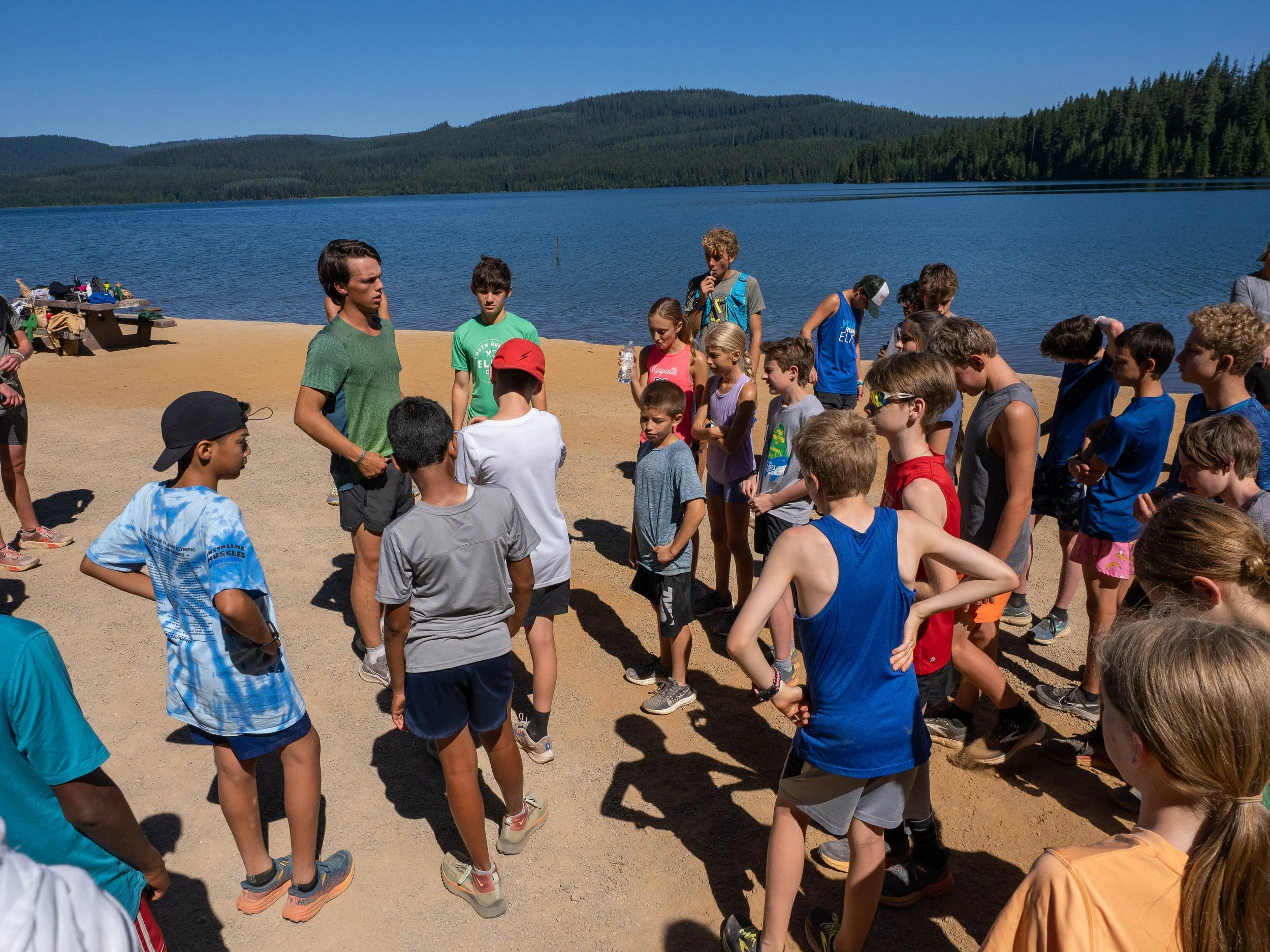 Group of athletes and teenagers gathered at the Elite Middle School Camp at Youth Runner Camps
