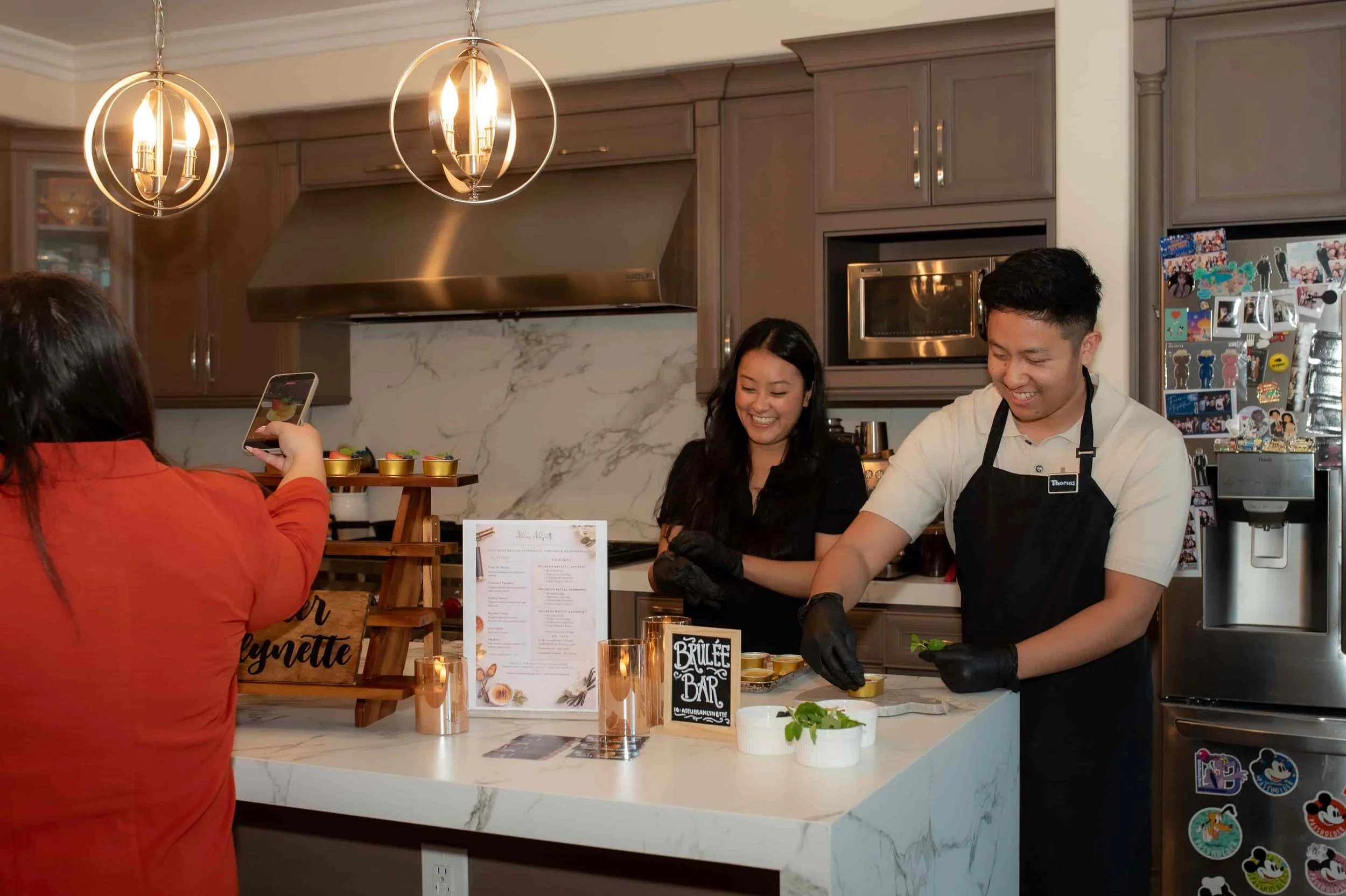 Live-torched crème brûlée catering setup at a private event in Los Angeles and Orange County with chefs preparing desserts for guests
