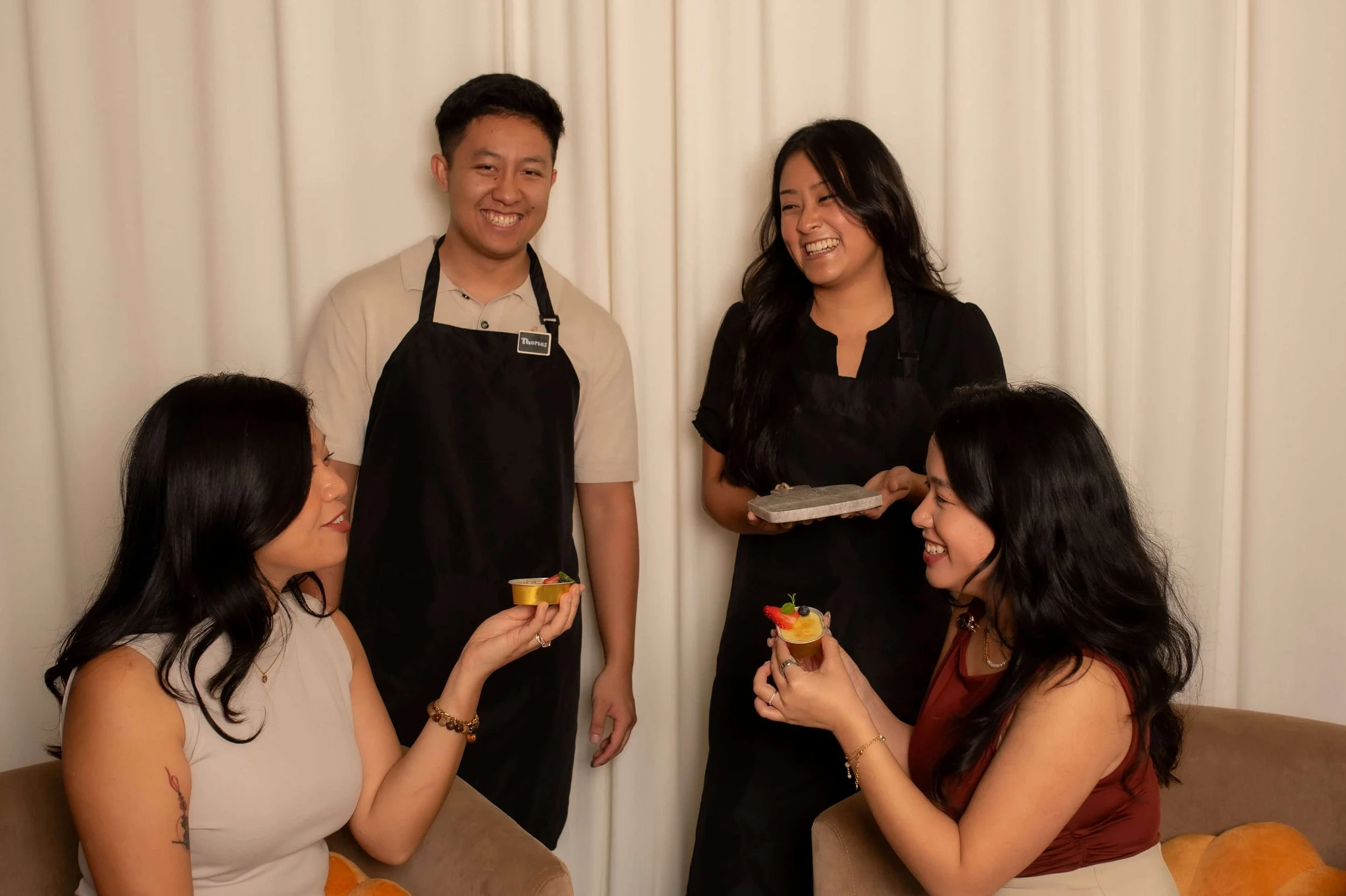 Guests enjoying artisan crème brûlée desserts by Atelier Anlynette