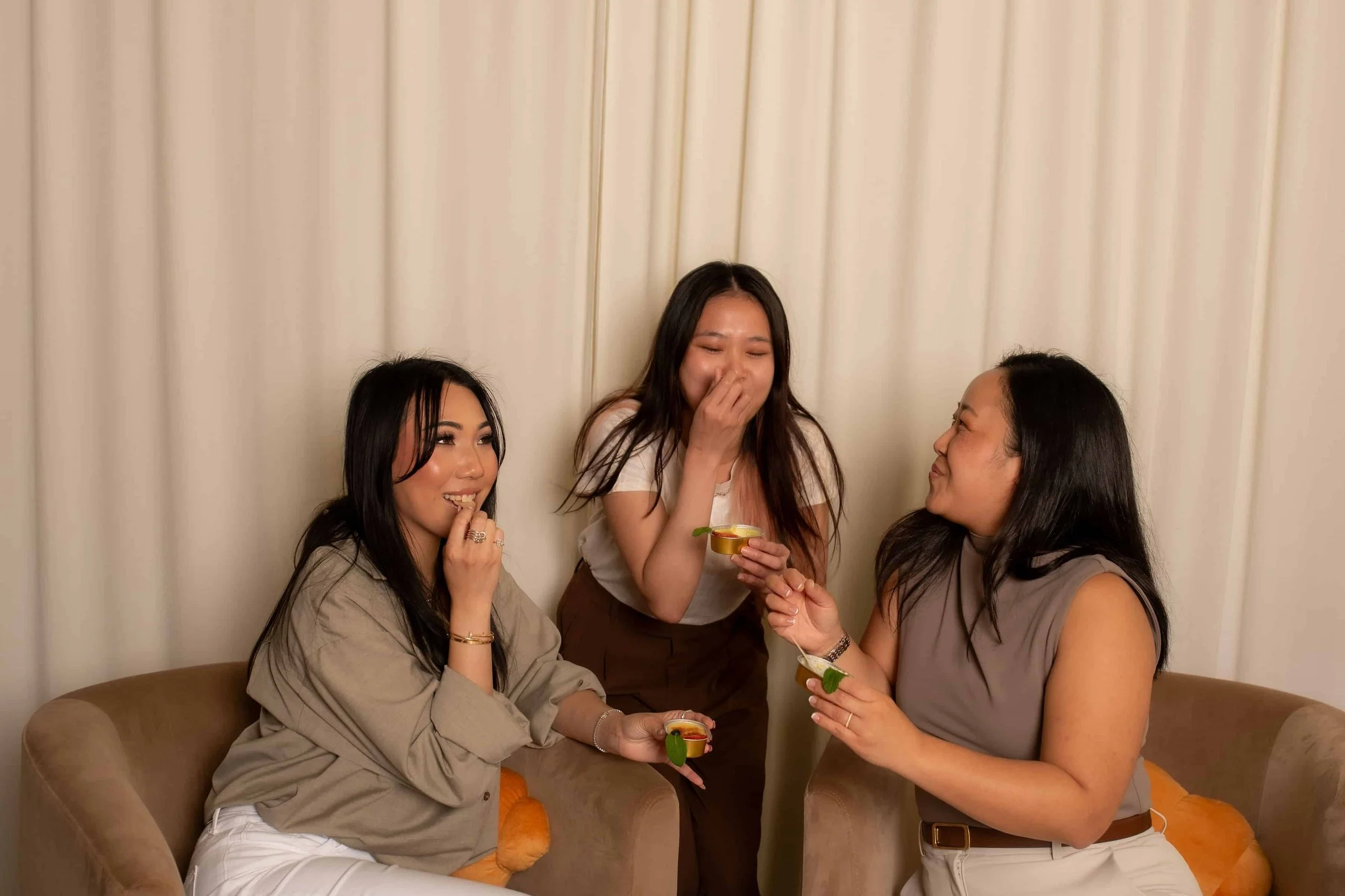 Friends enjoying mini crème brûlée desserts at a private event catering experience in Los Angeles and Orange County