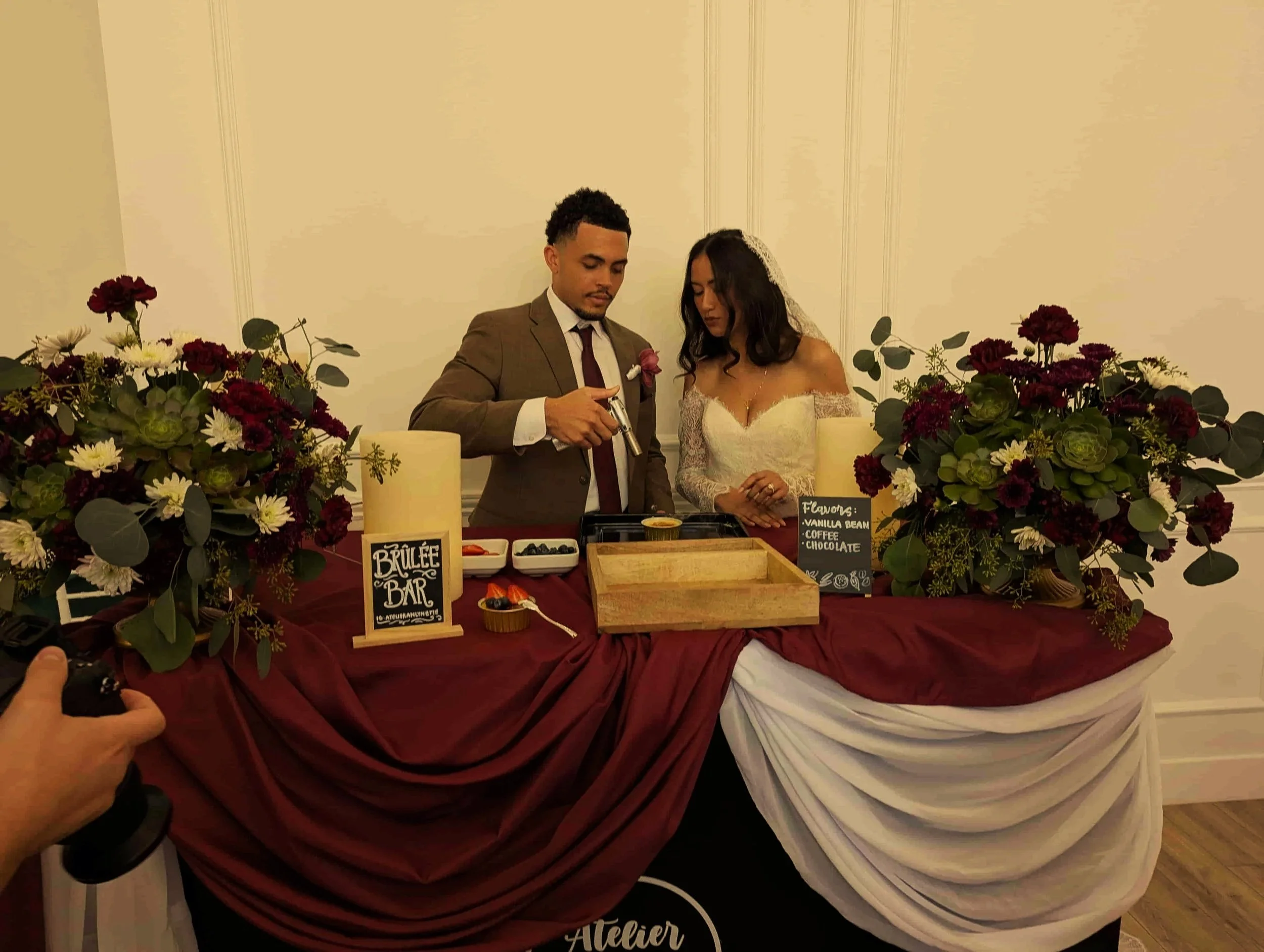 Bride and groom torching crème brûlée dessert bar catering at a wedding in Los Angeles and Orange County