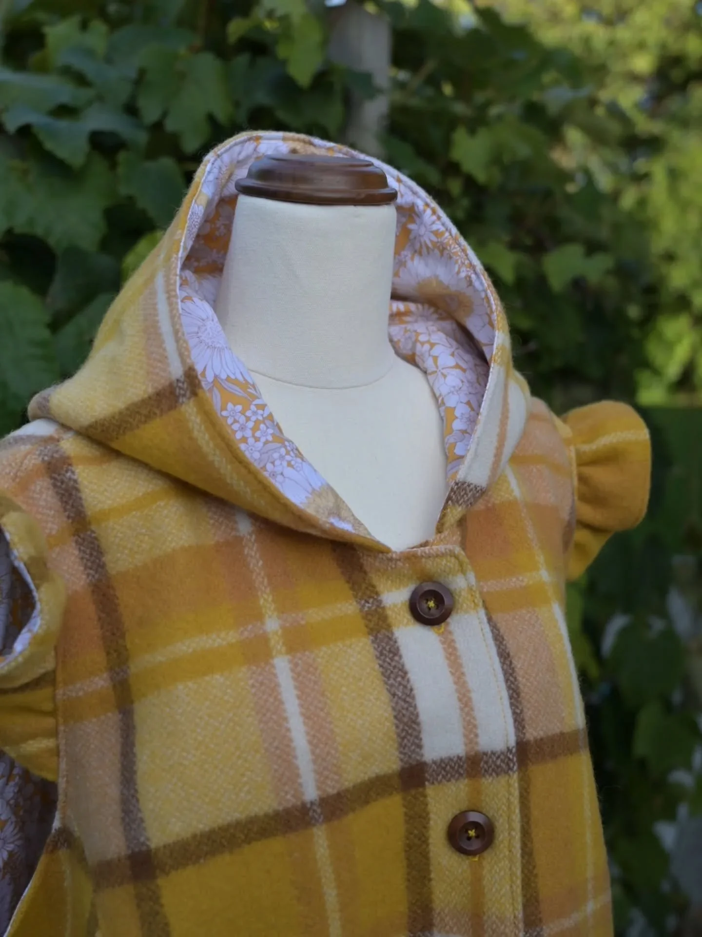 Just finished this cosy women's vest for a repeat customer. She chose a round hood, flutter sleeves, this gorgeous mustard check with and floral cotton lining. I love that she wanted to feature the original blanket label and stitching on the pockets 