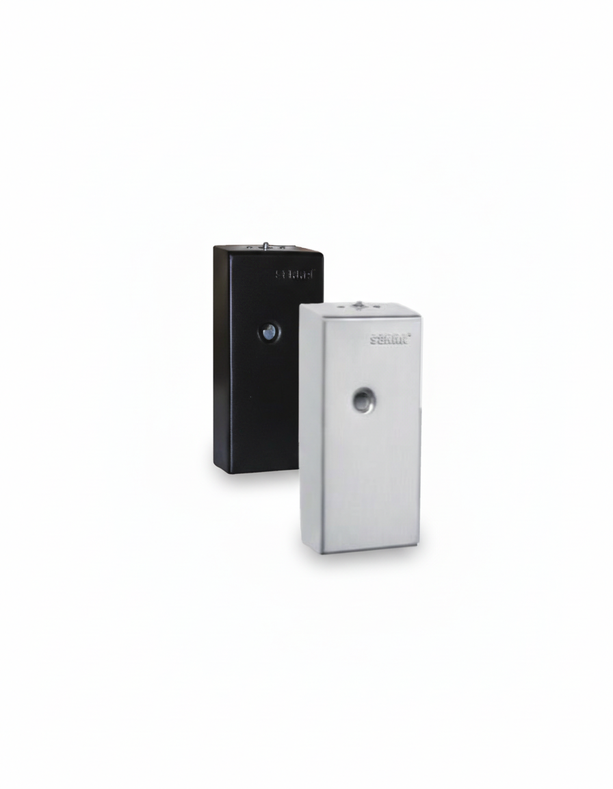 Two rectangular scent dispensers, one black and one silver, with circular openings in the center, placed against a white background.