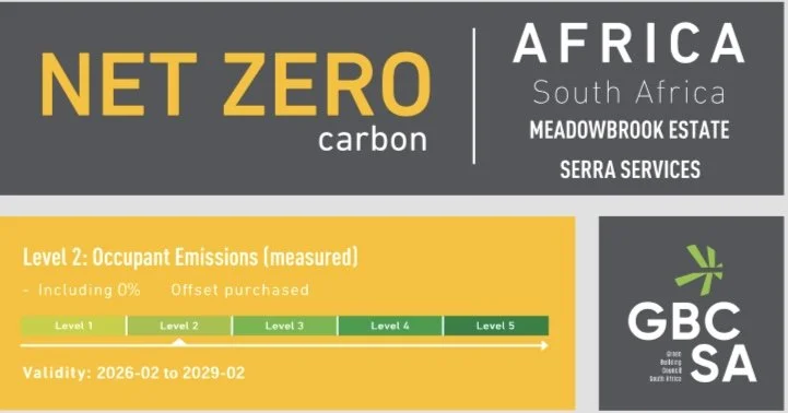A South African environmental label indicating Net Zero Carbon for Meadowbrook Estate, Serra Services, in Africa, South Africa, with a validity period from February 2026 to February 2029, featuring a GBCSA logo and color-coded levels of occupant emissions.