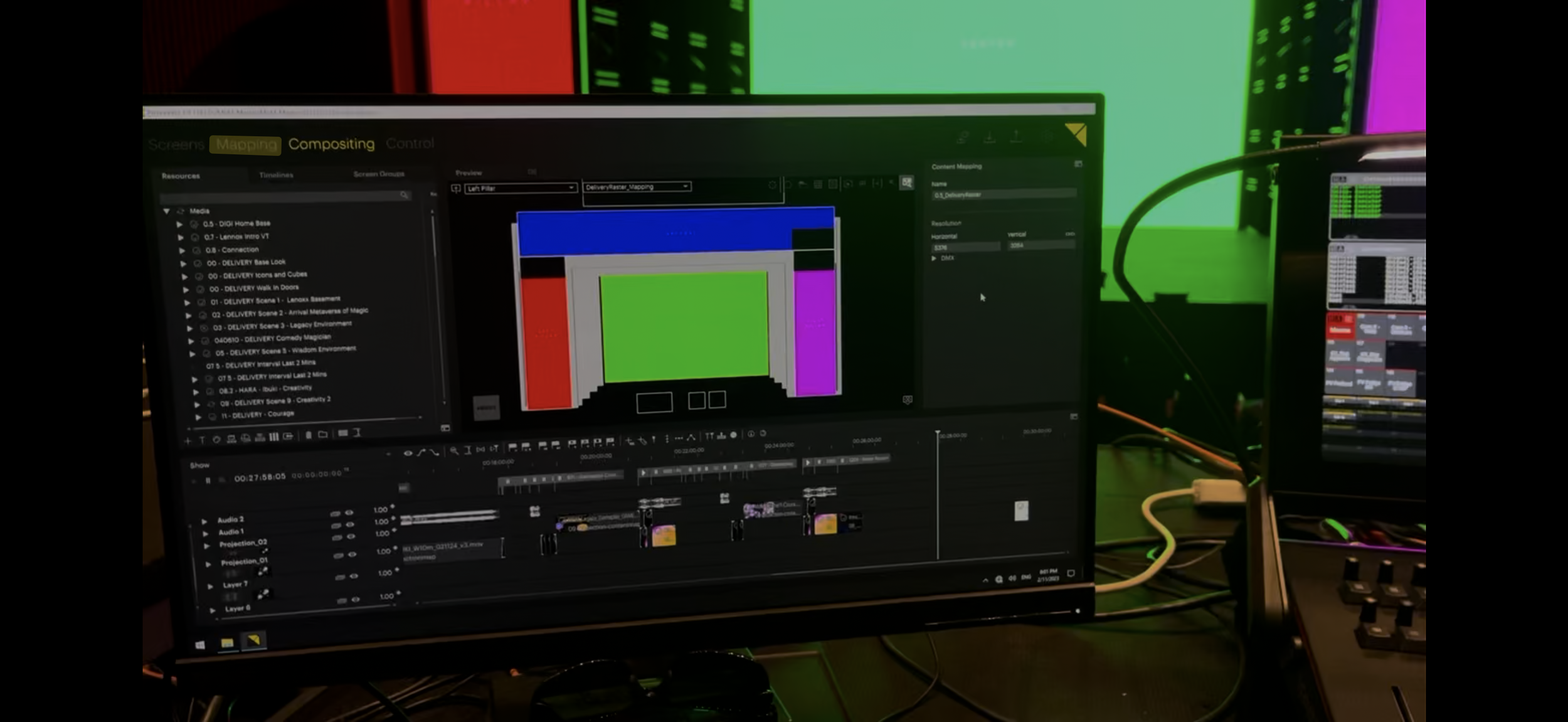 Computer screens displaying video editing and broadcasting software, with color bars and waveform graphics in the background.