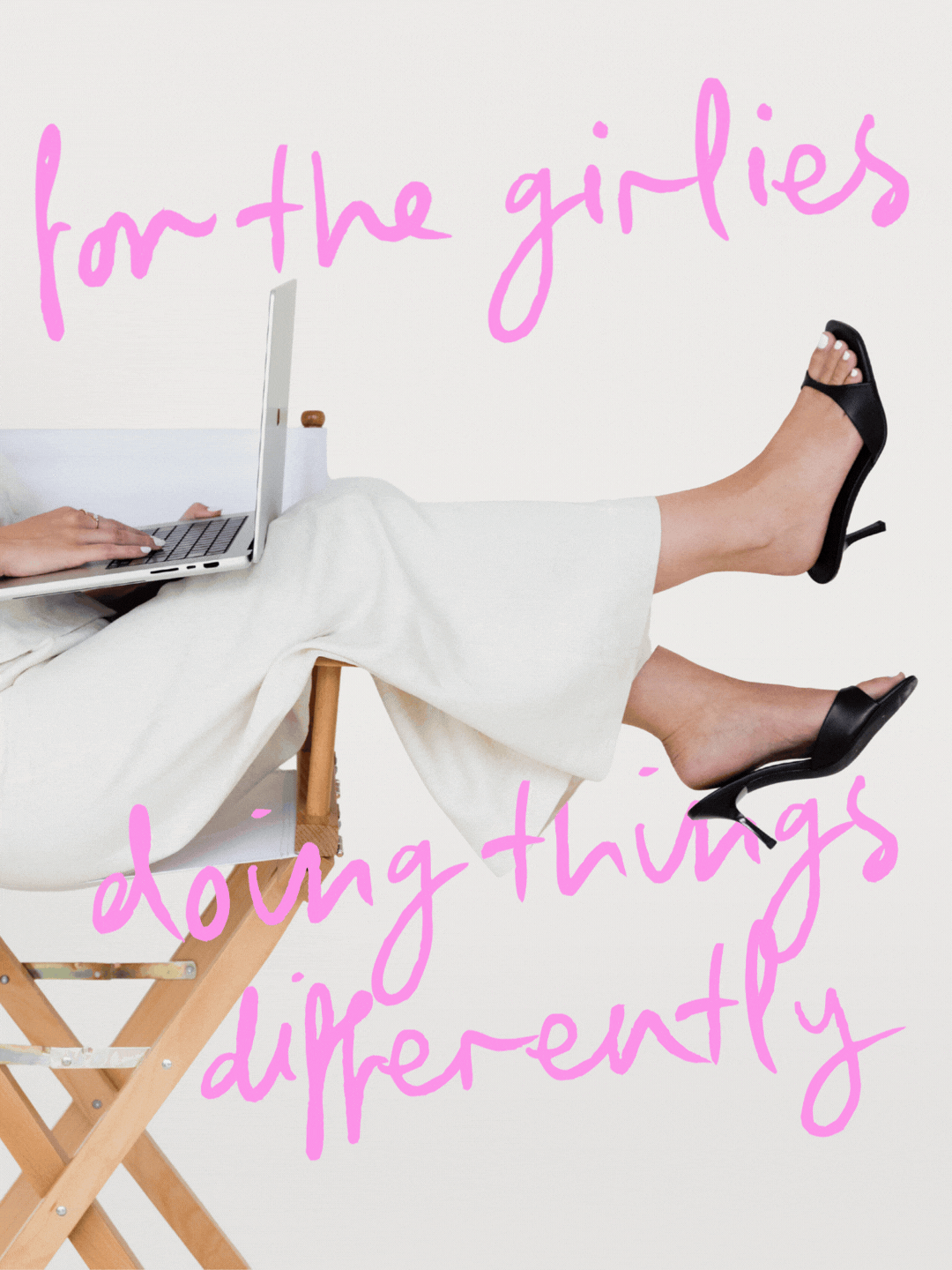 Person lying on a wooden chair with legs up, using a laptop, wearing black high heels, with pink handwritten text overlay that says 'for the girls doing things differently'.