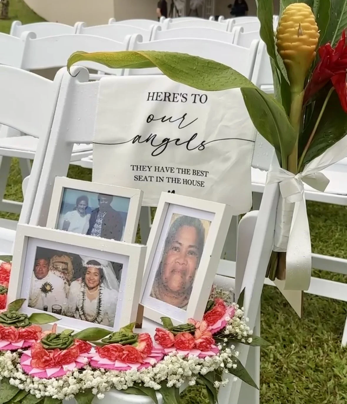 Wedding memorial display honoring loved ones who have passed adorned with a beautiful Hawaiian lei at Ko'olau Ballrooms