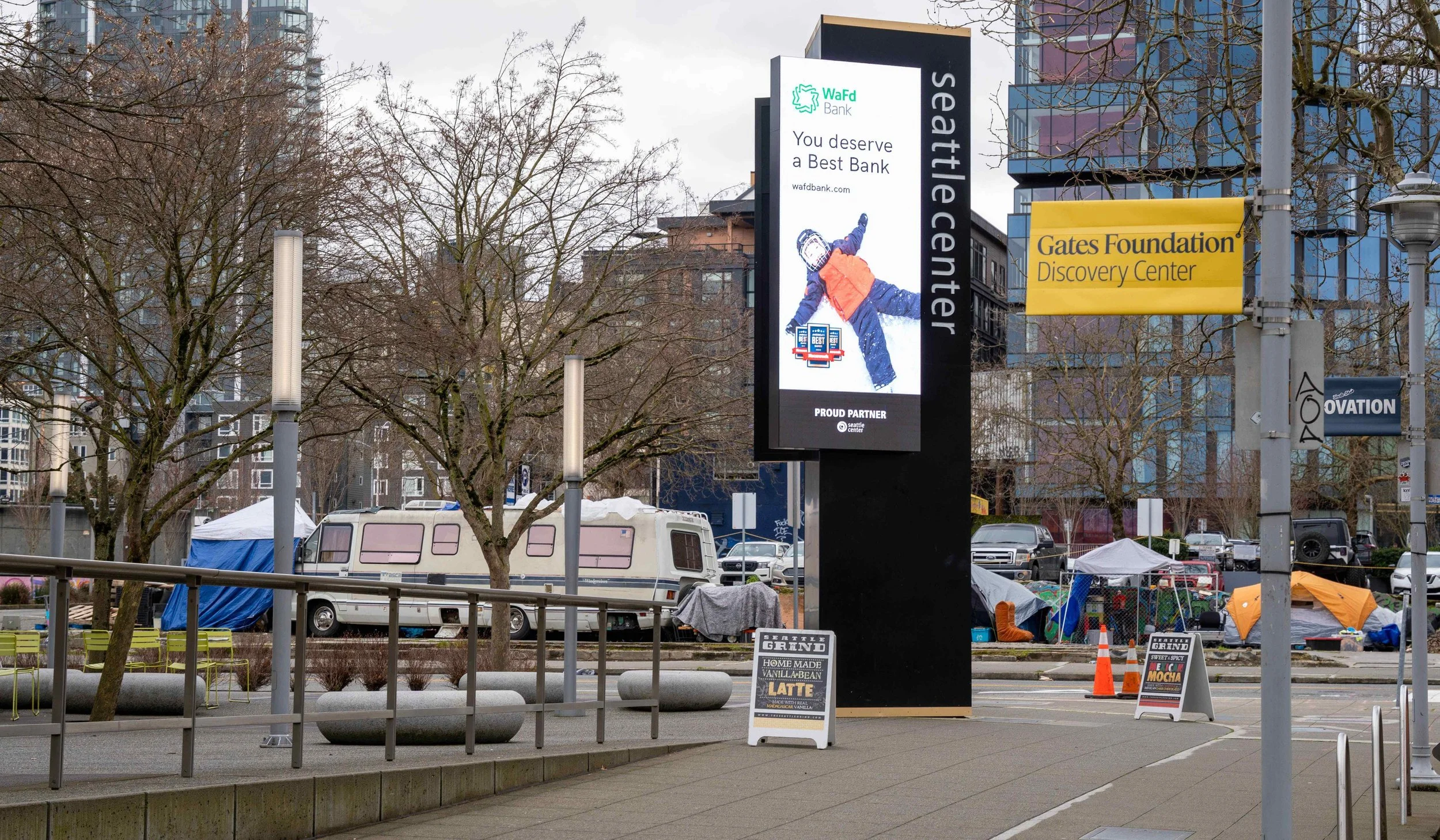 Detailed view of a resident motorhome and survival gear parked near the Seattle Center and Museum of Pop Culture (MoPOP).