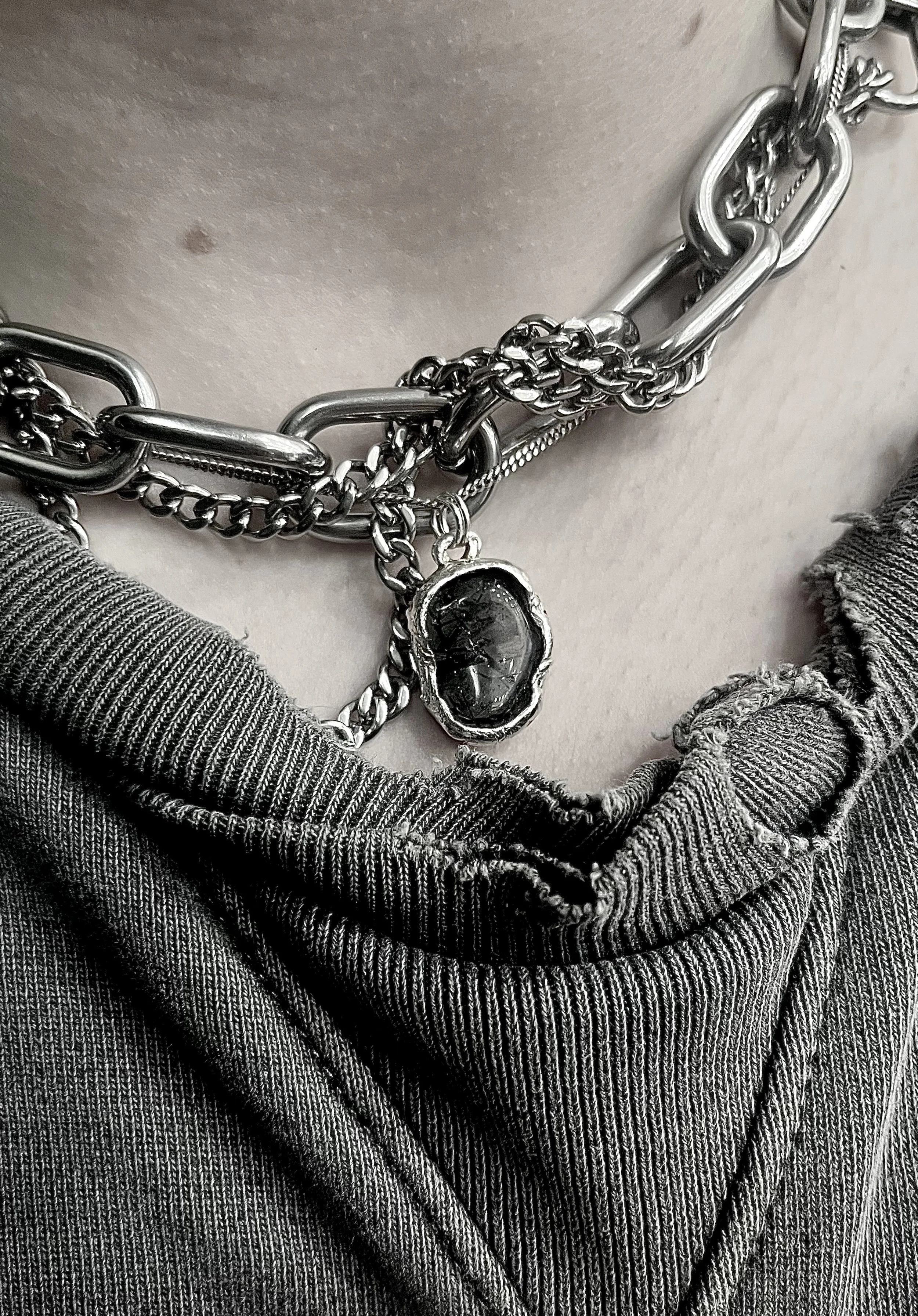 CUSTOM PENDANT (2025).
tourmalinated quartz - my first experience incorporating another material into a piece.