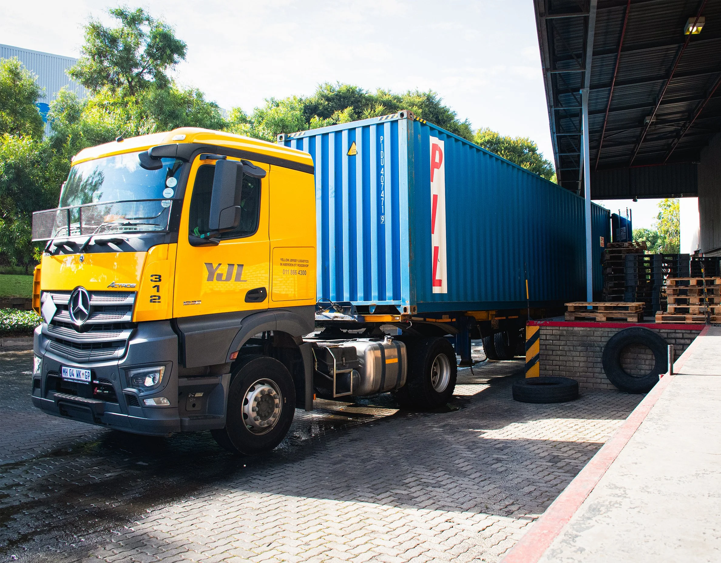 Shipping truck collecting goods