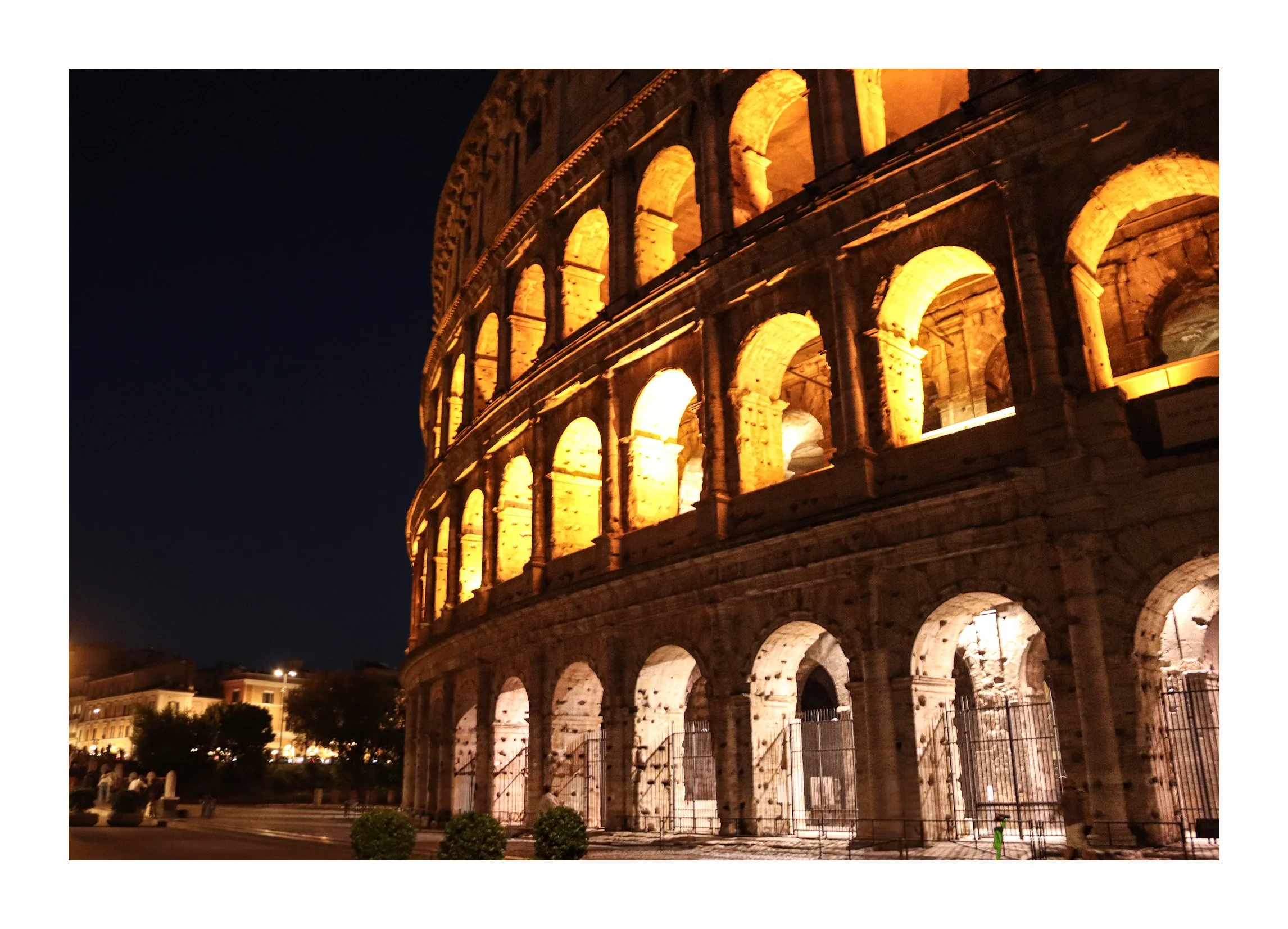 Night view of the illuminated Colosseum in Rome, Italy.