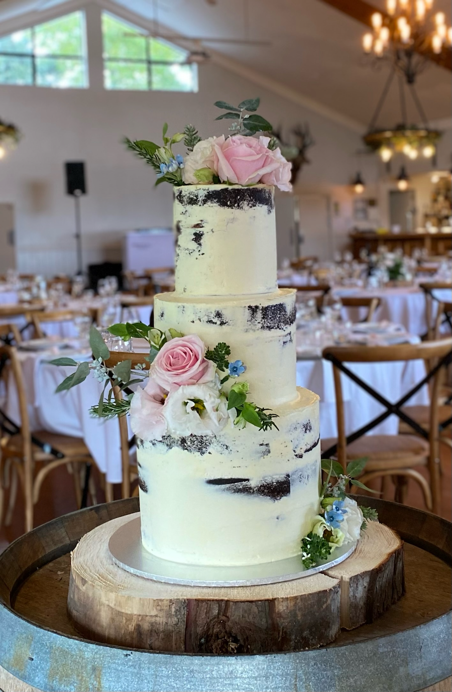 Three-tier semi-naked wedding cake - carrot cake, and red velvet.