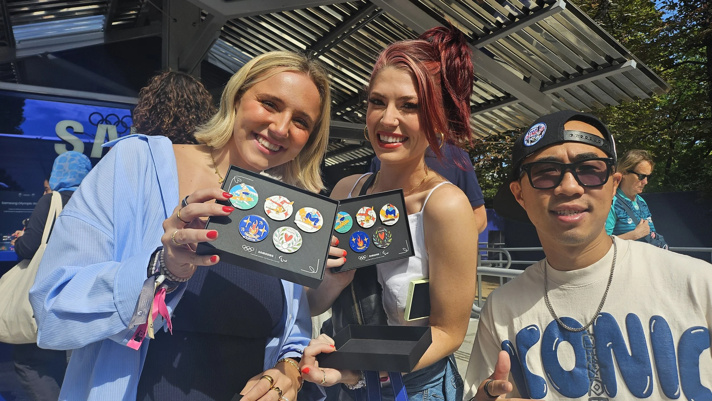 Happy Participants showing off Samsung Olympic Games Pins at the Pin Master Event in Paris