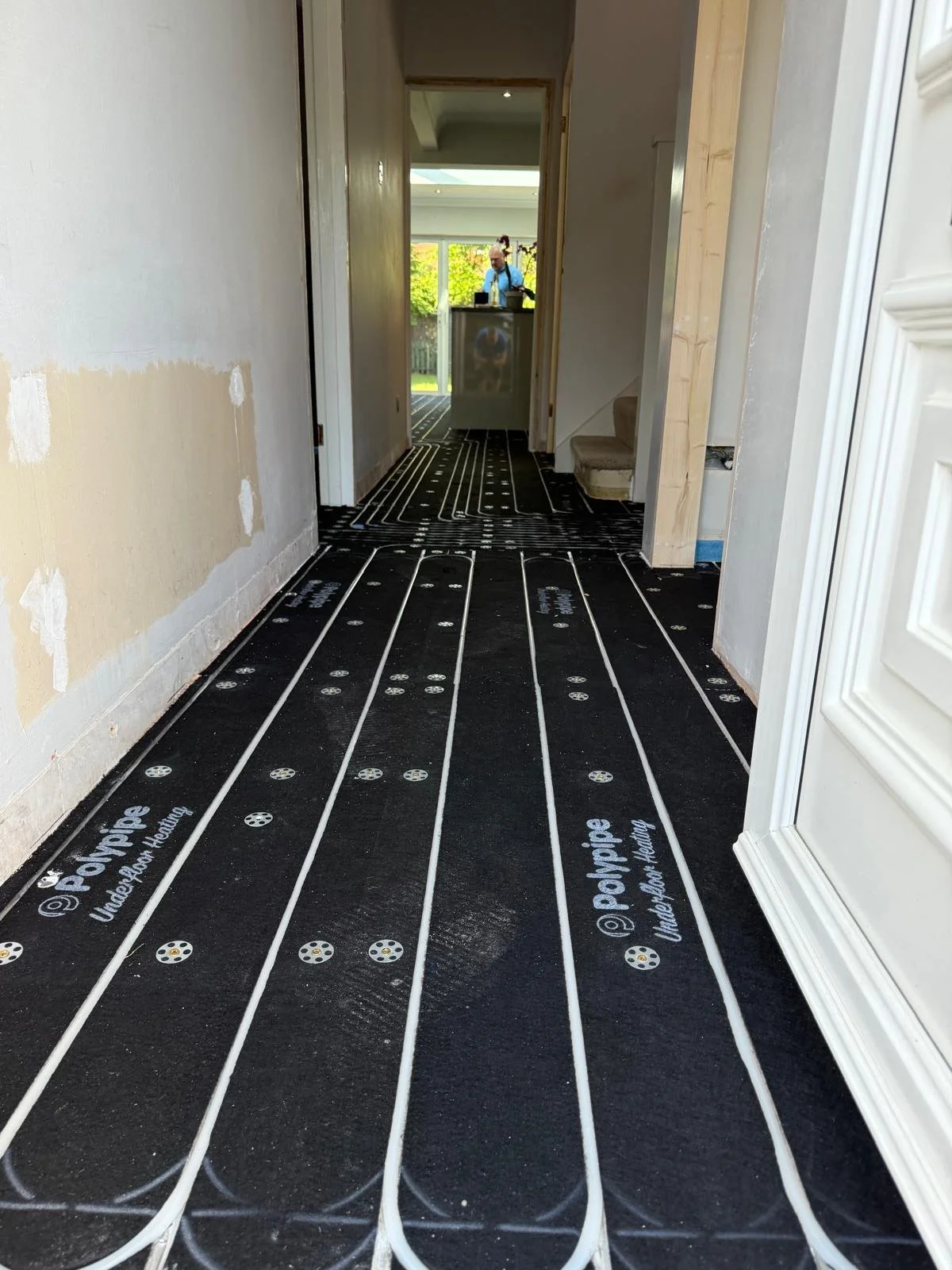 Water fed Underfloor Heating installed by a plumbing company in 
preparation for our work.