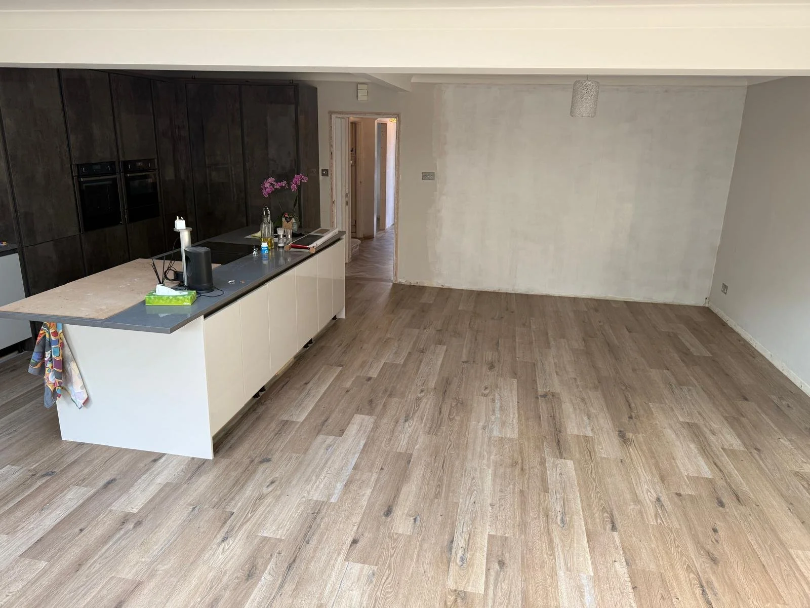 A  kitchen with luxury vinyl wood effect flooring,  installed by Fantastic Flooring 