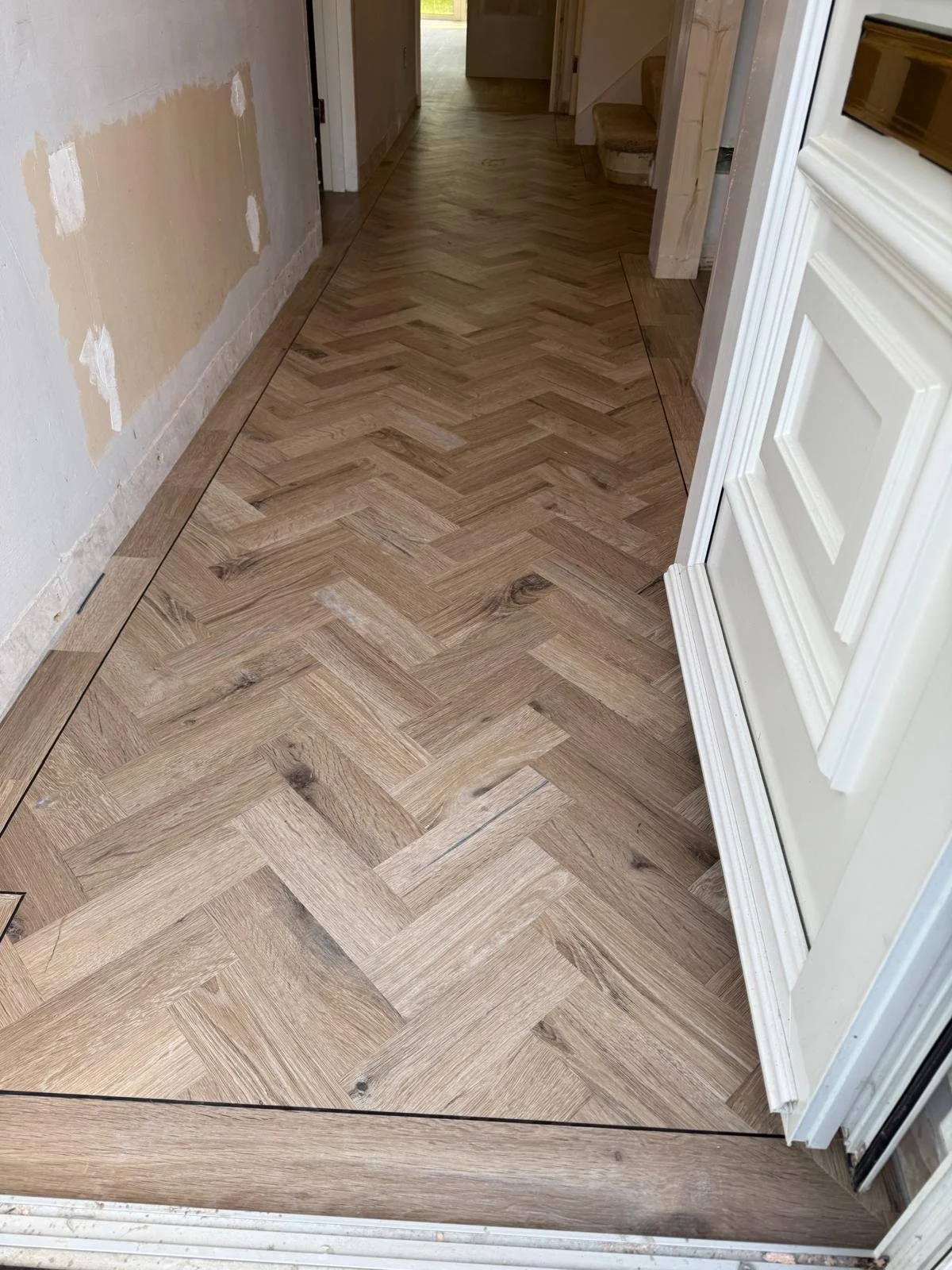Entrance hall installed with Karndean Knight tile traditional character oak.  3 mm designed strip to follow the perimeter.