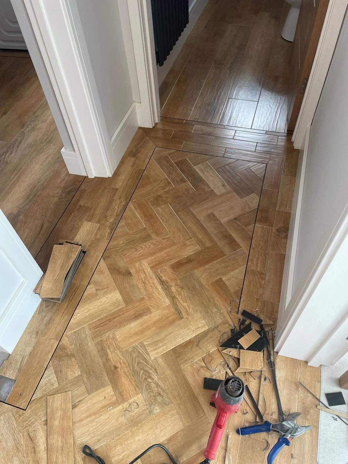 Entrance Hall, Utility room and cloakroom installed with Karndean art select spring oak with matching full-size planks into other areas 