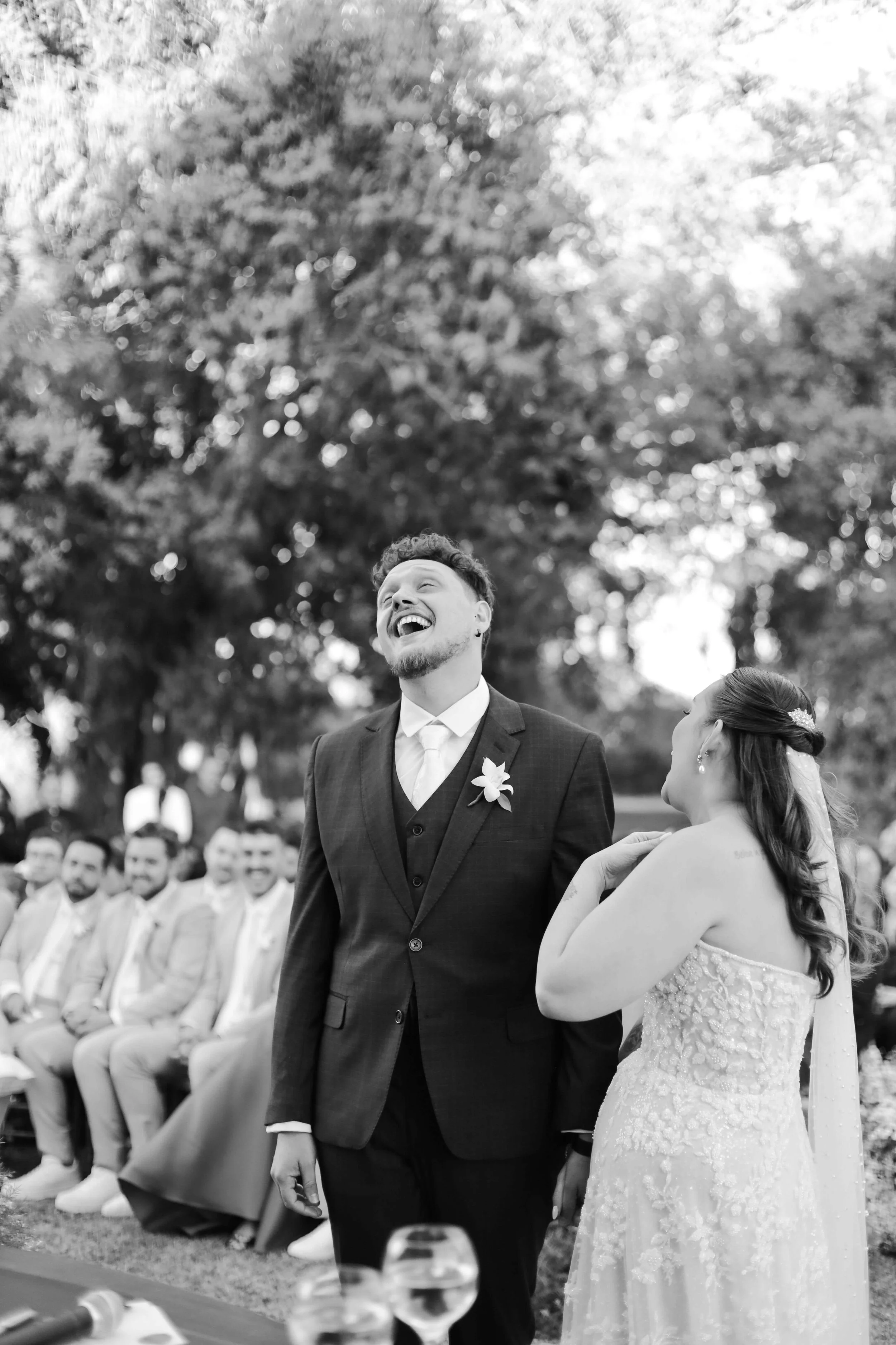 groom stood in the aisle laughing with his bride