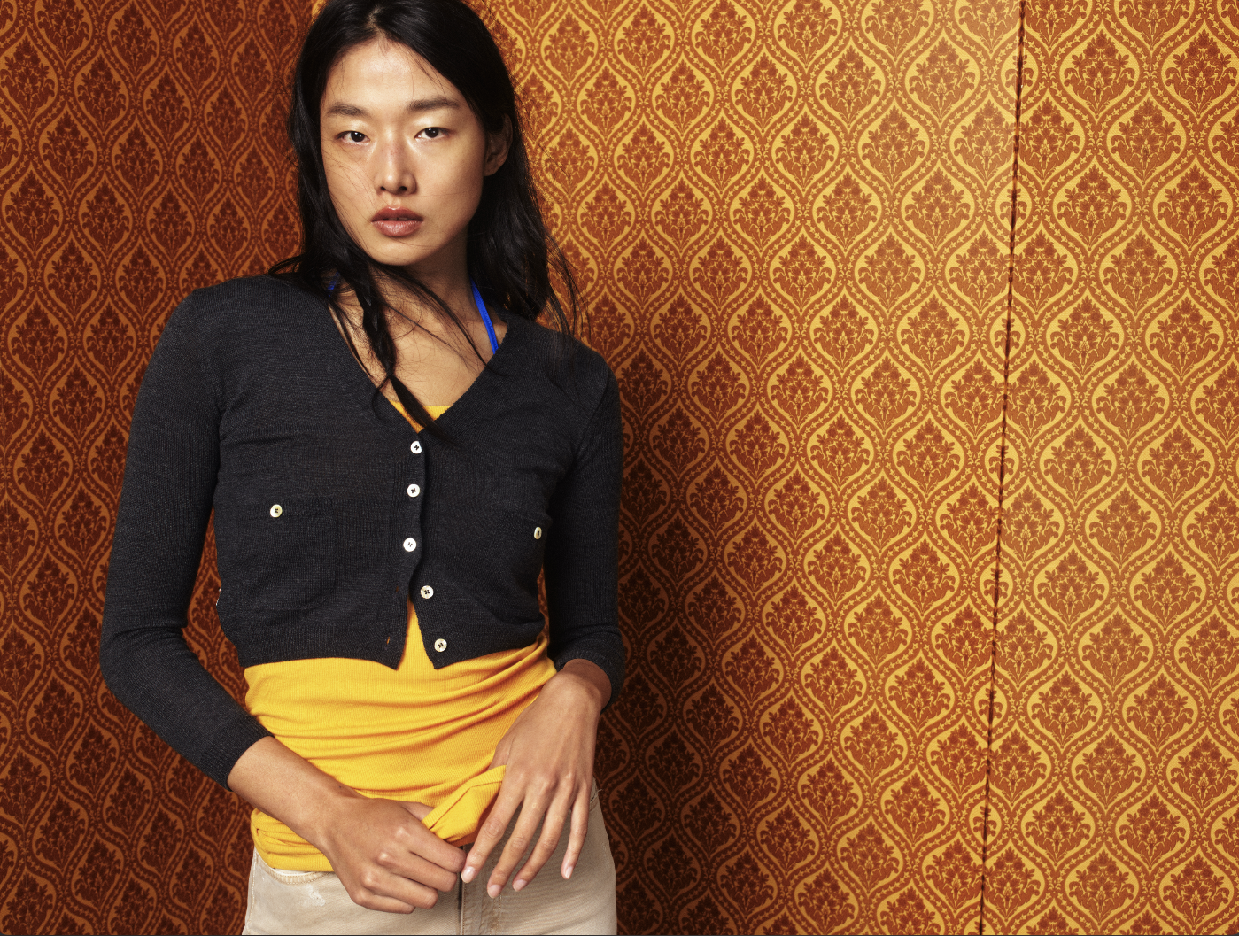 Asian model against a yellow backdrop