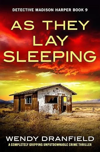 Book cover for 'As They Lay Sleeping' by Wendy Dranfield, featuring an old, weathered house in a desolate landscape with a dramatic sunset sky.