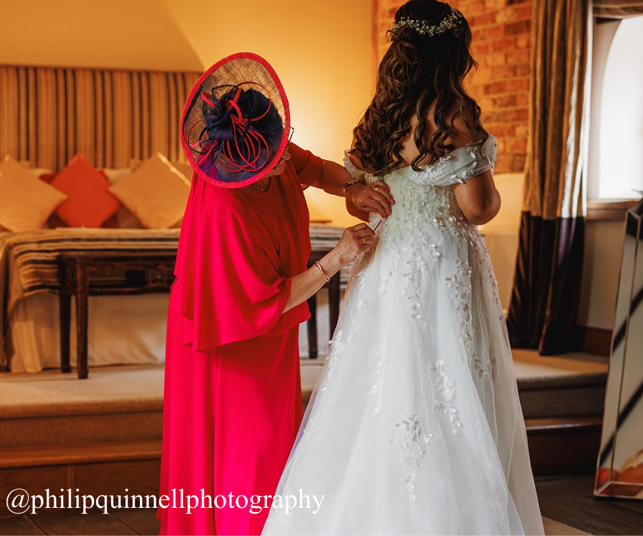 mother of the bride dressing bride