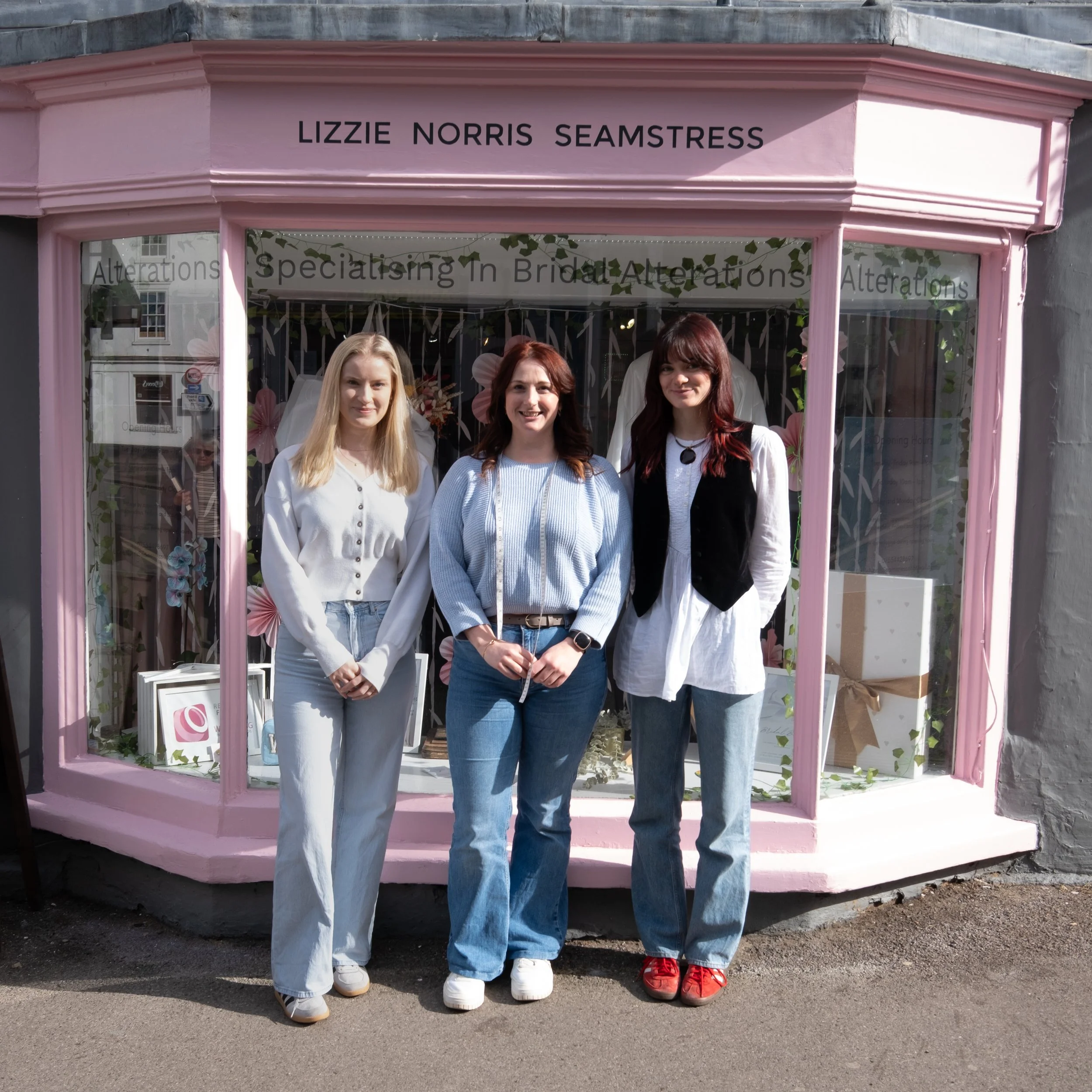 Staff photo outside shop