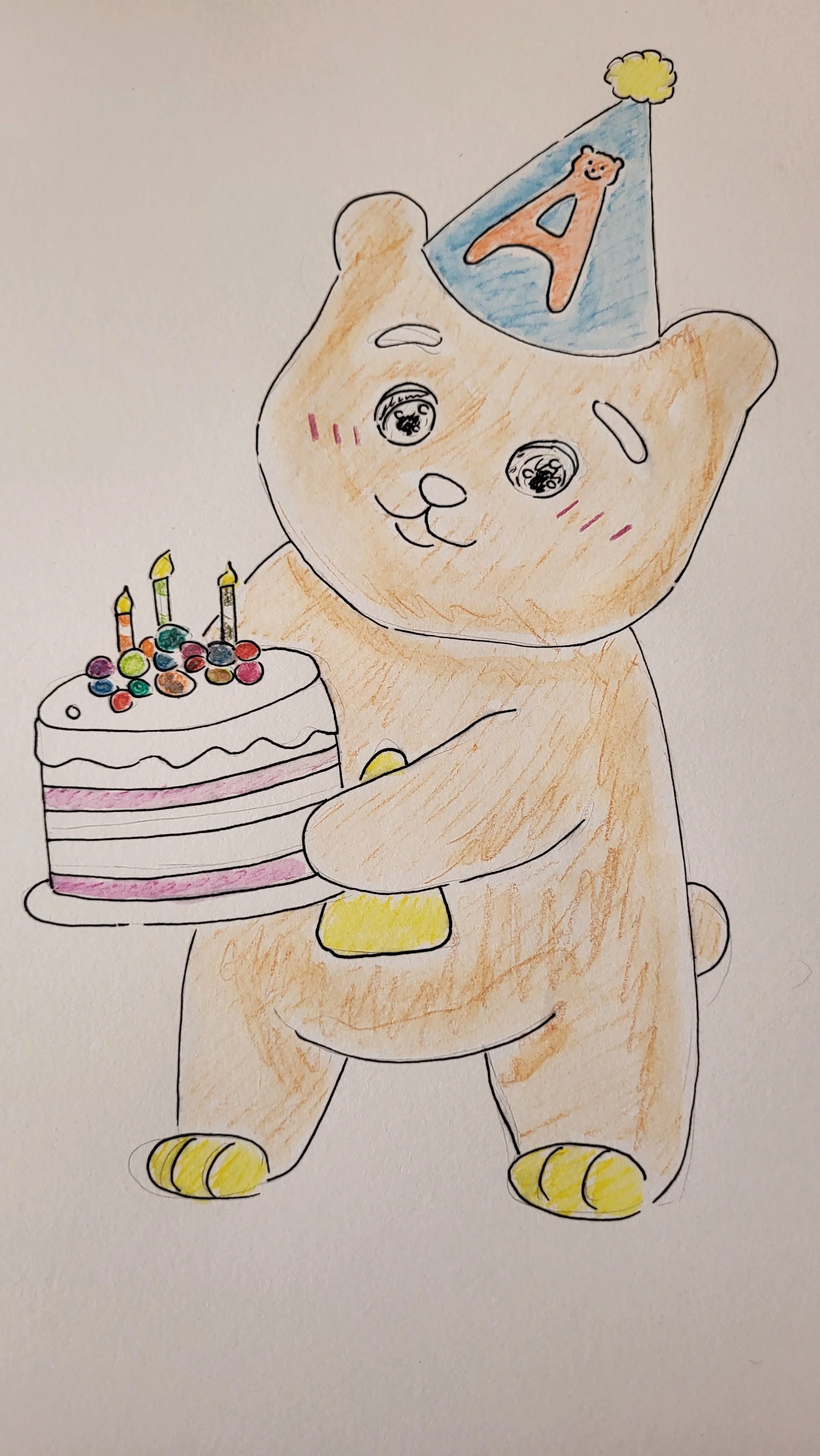 A drawing of a cute bear wearing a blue party hat with an orange letter A and a bear face cartoon, holding a birthday cake with colorful toppings and candles, on a white background.