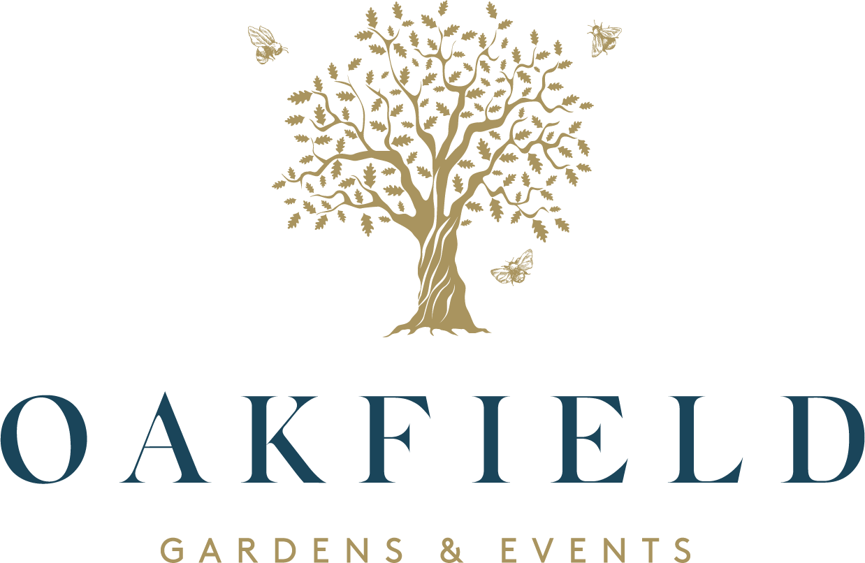 A logo for Oakfield Gardens & Events showing a stylized tree with birds and a butterfly, with the name 'OAKFIELD' in large stylized text and 'GARDENS & EVENTS' below.