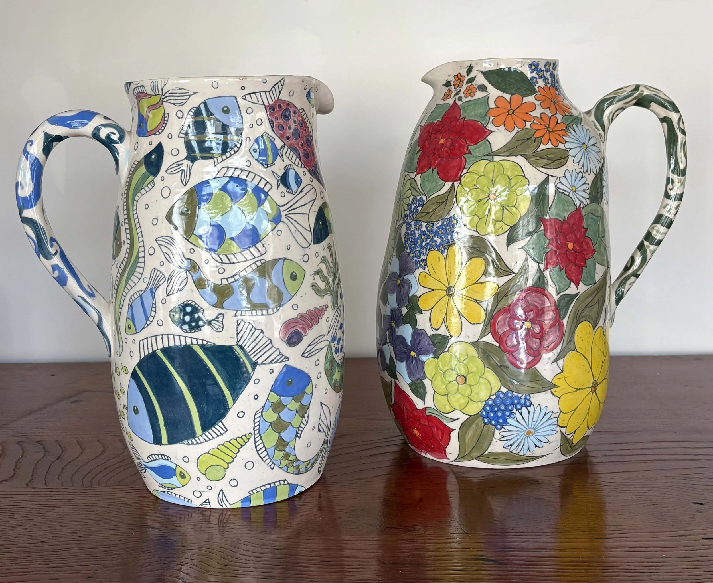 Diana Parker Ceramics
Handpainted 'Fish' and 'Flowery' Jugs
Handthrown White Earthenware Clay