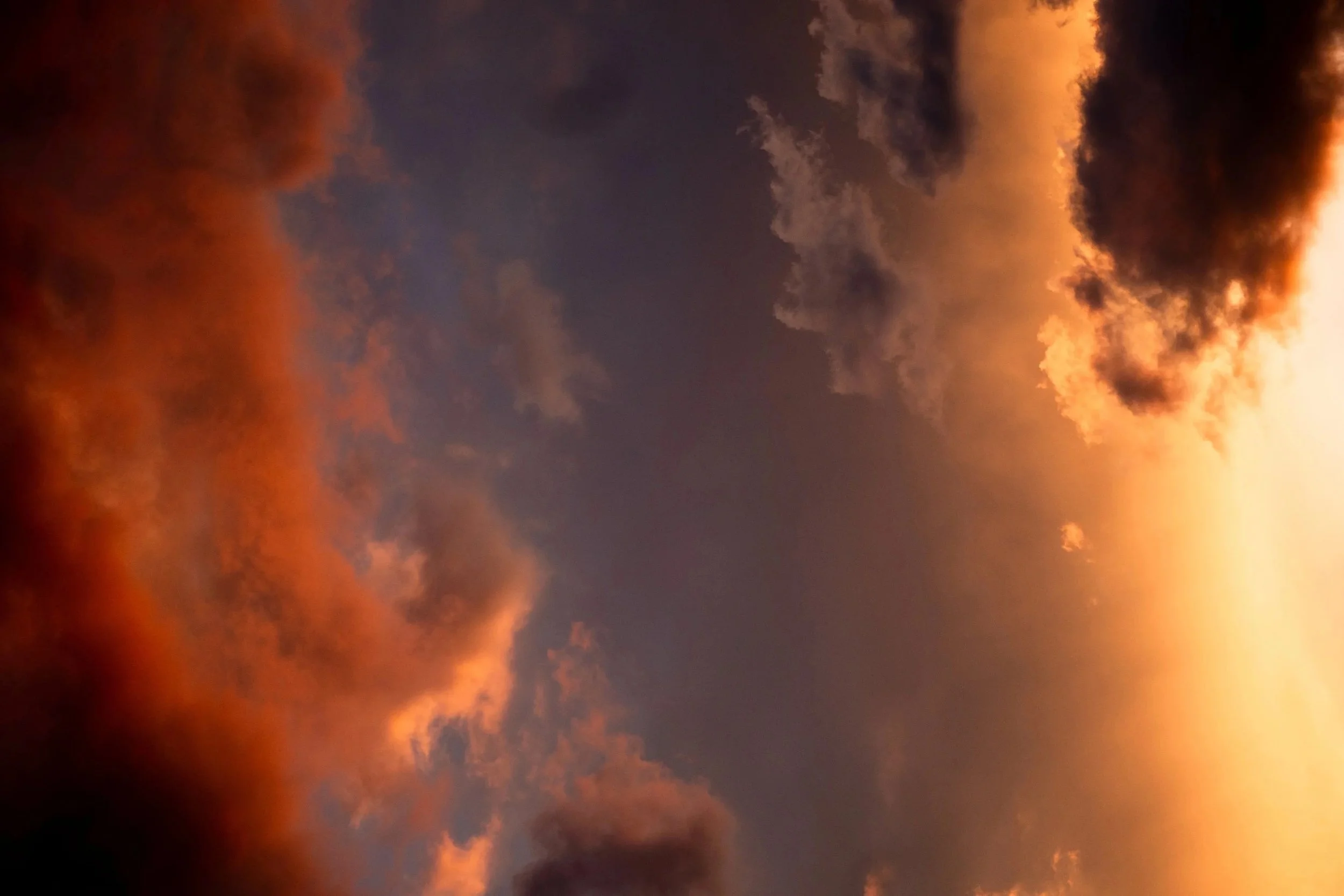 A sunset sky with glowing clouds.