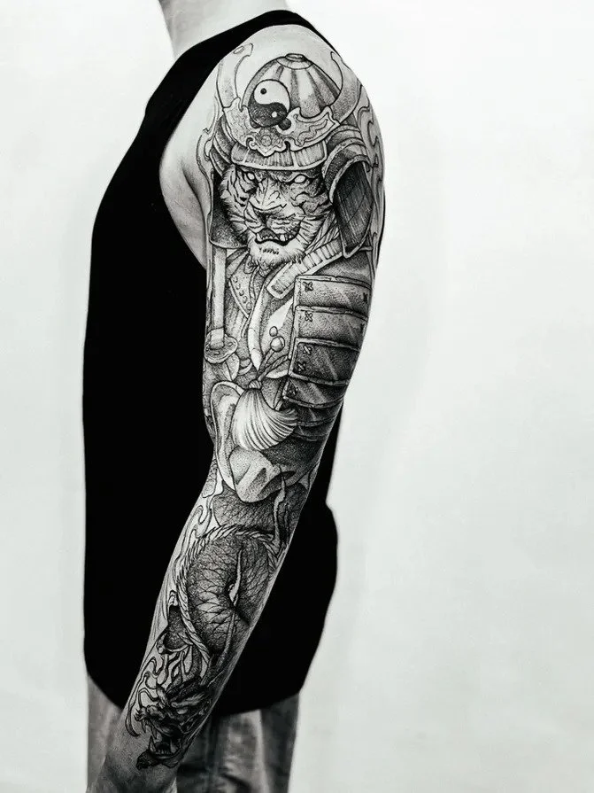 Black-and-gray tiger samurai full sleeve tattoo.
