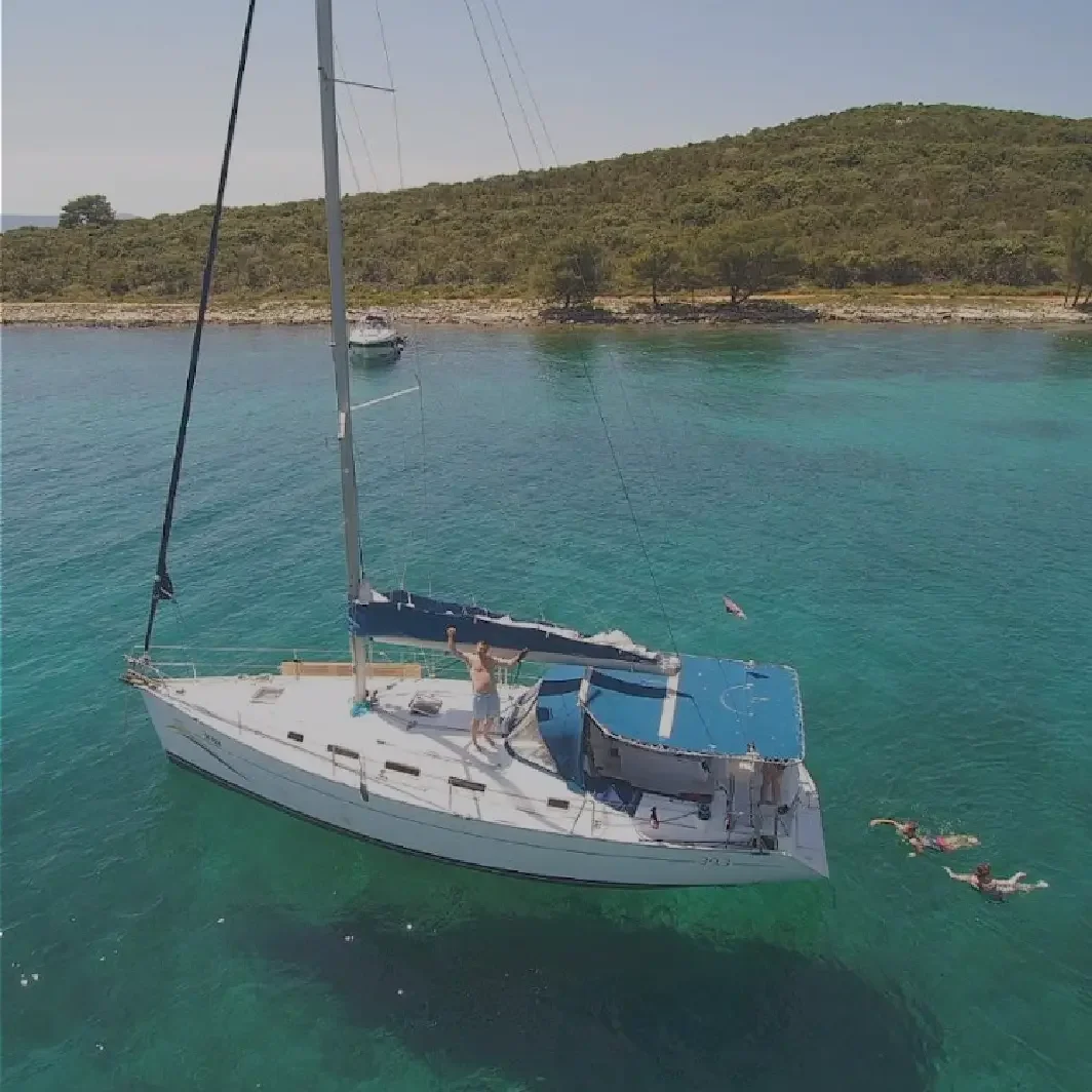 A luxury sailboat gliding through the crystal-clear turquoise waters of the Zadar islands.