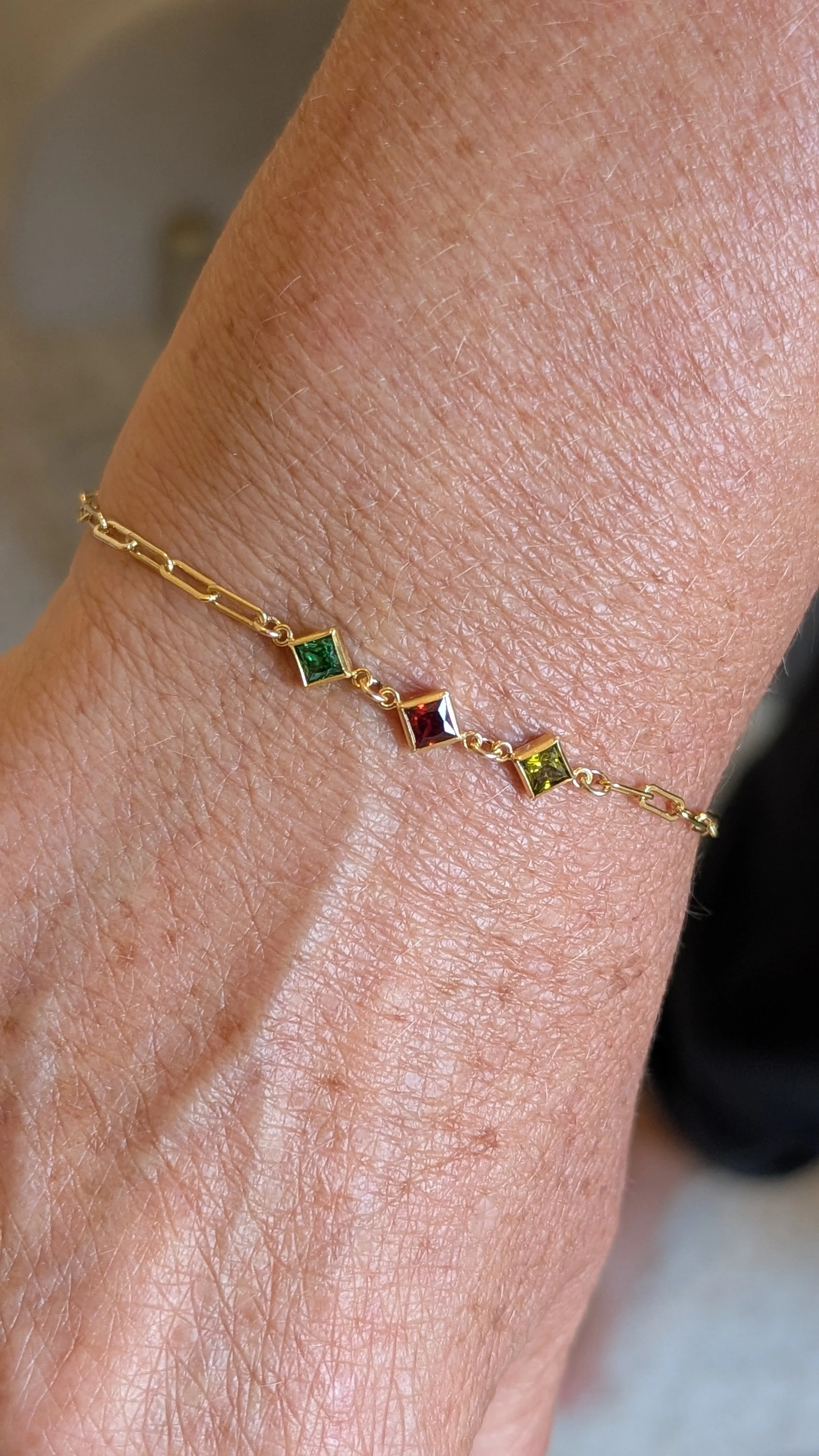 Gold Permanent bracelet with birthstones.jpg