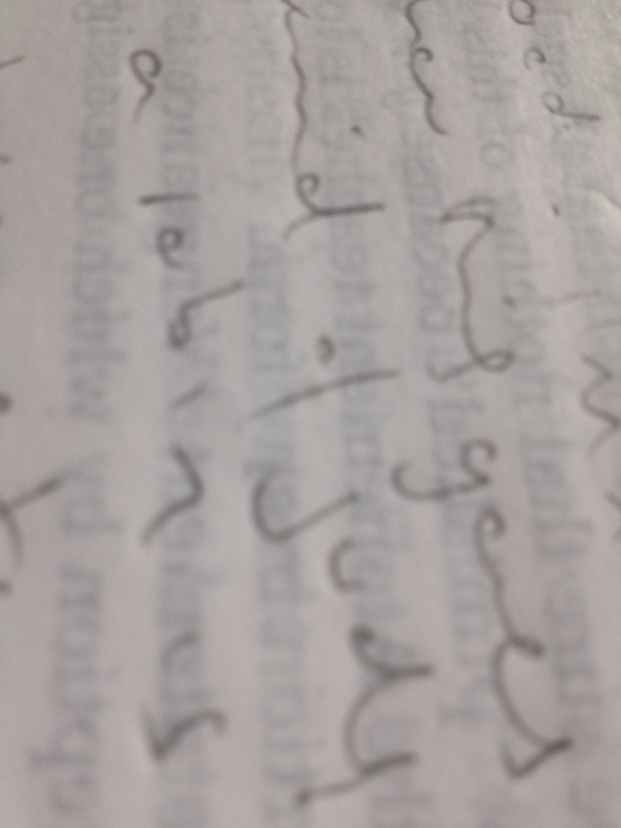 Close-up of a handwritten note with cursive writing on paper.