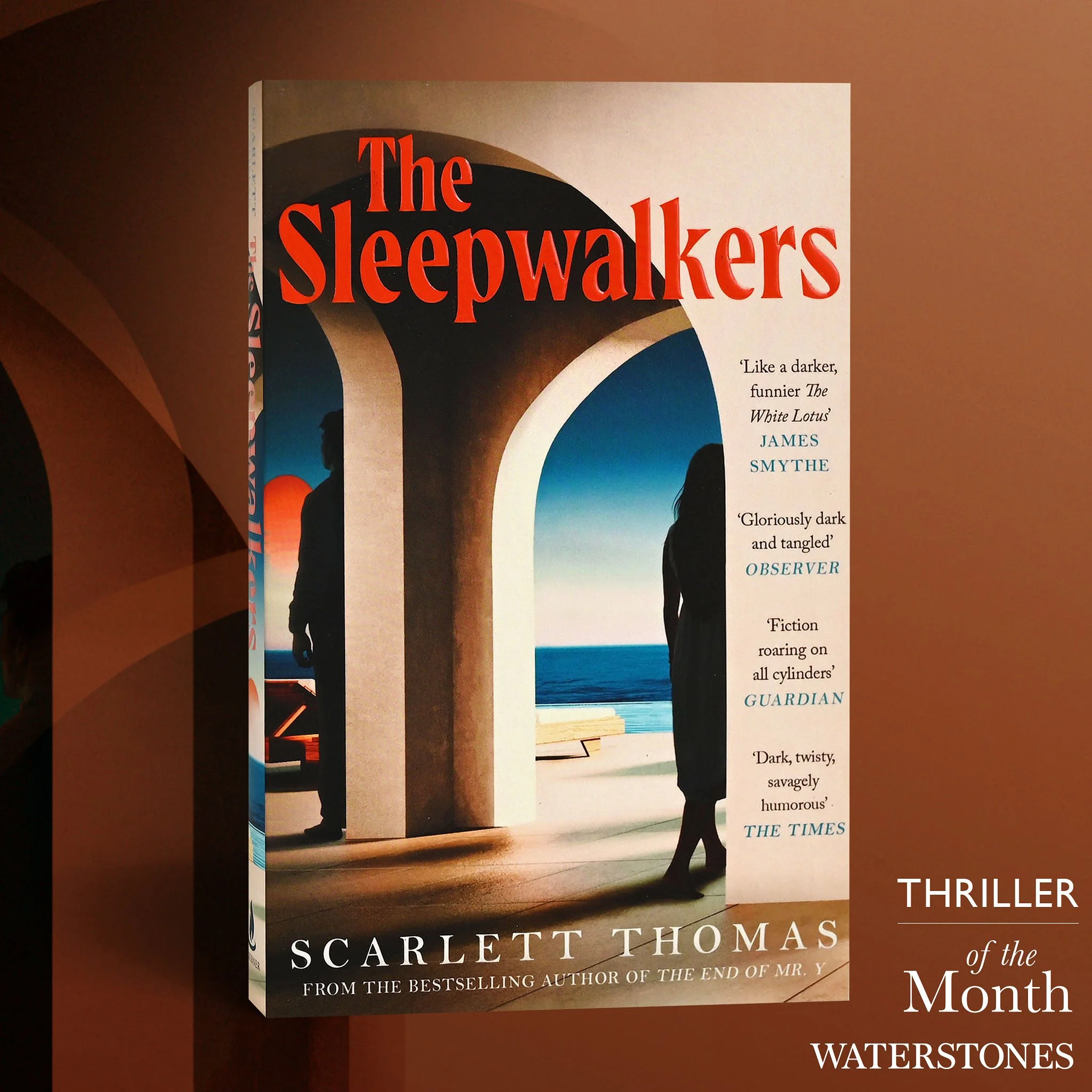 Book cover for 'The Sleepwalkers' by Scarlett Thomas, depicting two silhouetted figures, one male and one female, walking through an archway with a view of the ocean and sunset.