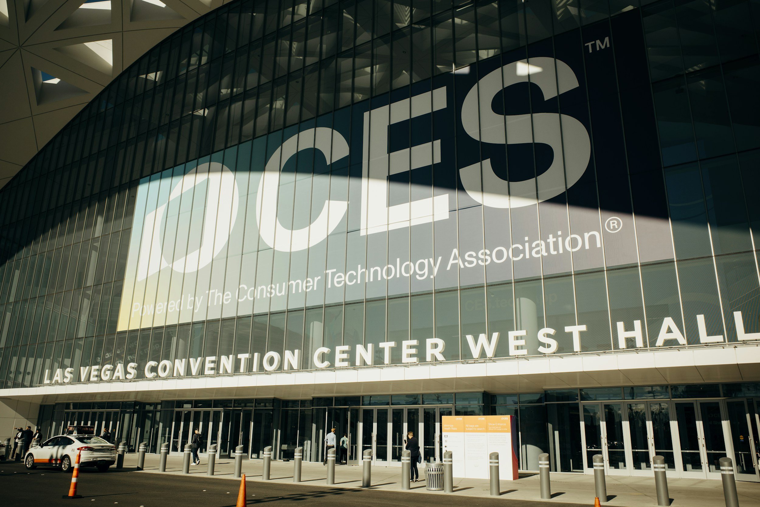 Exterior of the Las Vegas Convention Center West Hall with large signage for the Consumer Technology Association.