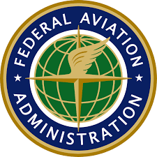 Logo of the Federal Aviation Administration featuring a globe, a winged arrow, and a blue circular border with white text.