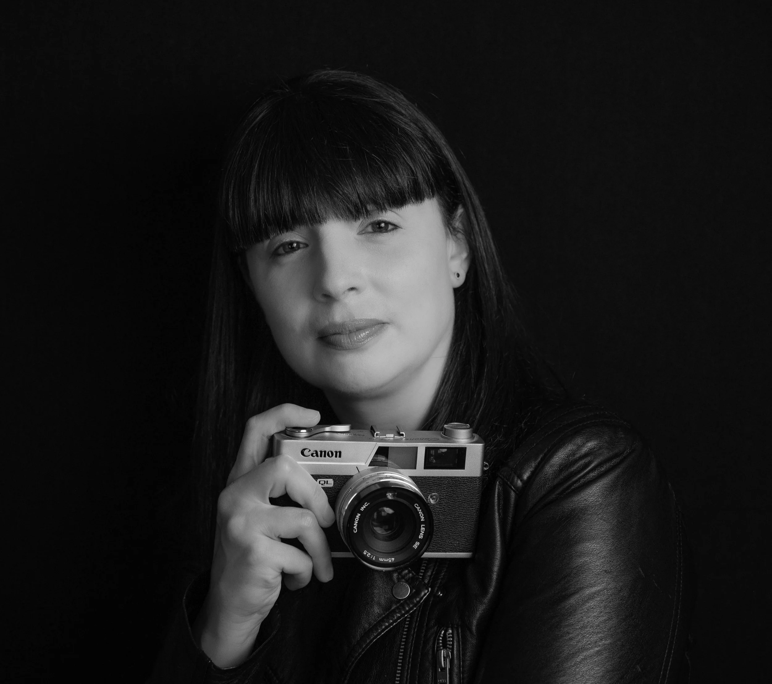 Portrait of Tara Woods holding a film camera — natural, editorial wedding photographer based in Meath, Ireland