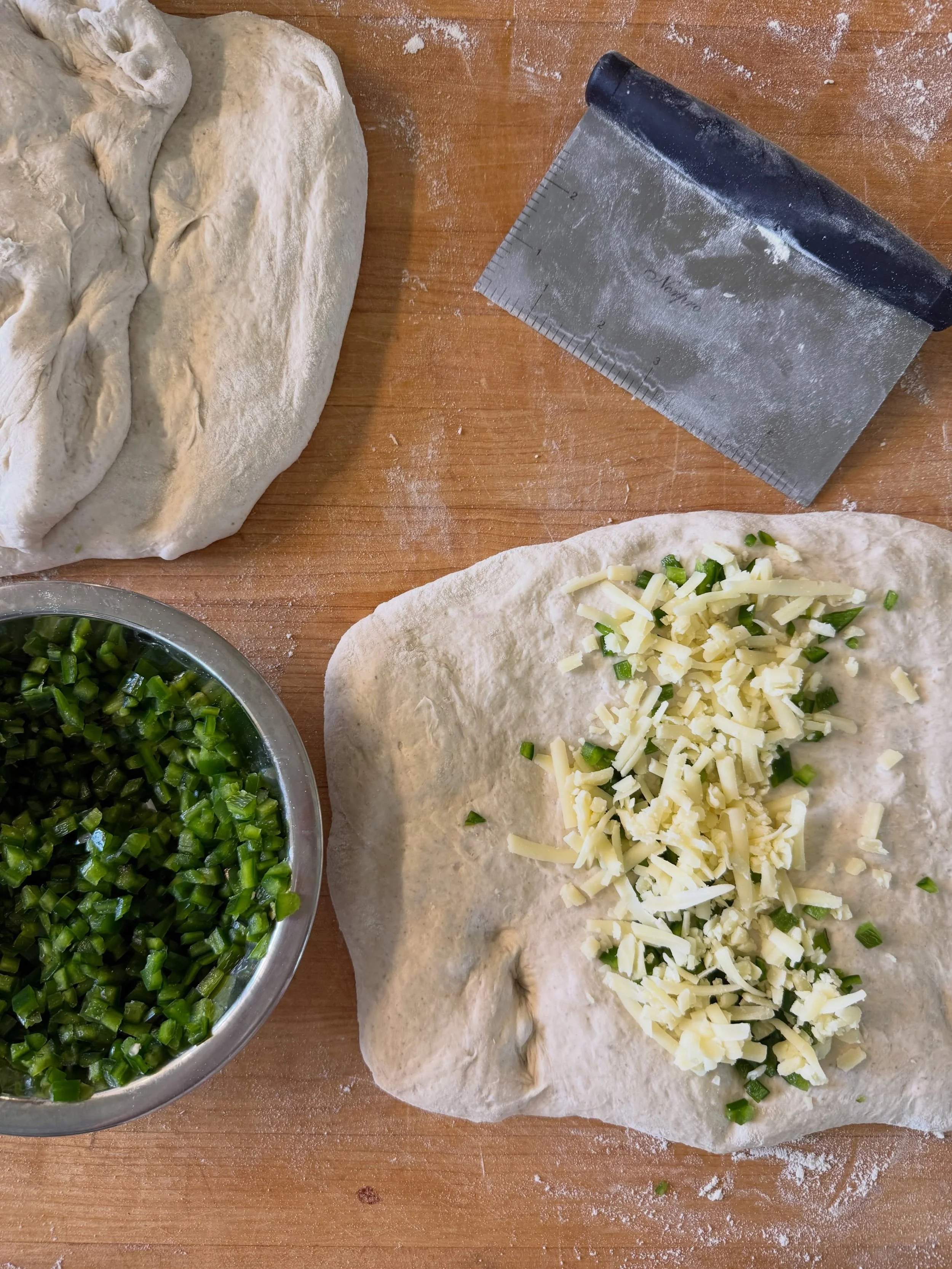 Next up &mdash;> FOLDING! We like to fold organic white cheddar [hand grated] and organic jalape&ntilde;os [hand chopped] into our jalape&ntilde;o cheddar sourdough to ensure you get the good stuff in every bite! YUMMMM 
Come by this weekend to gr