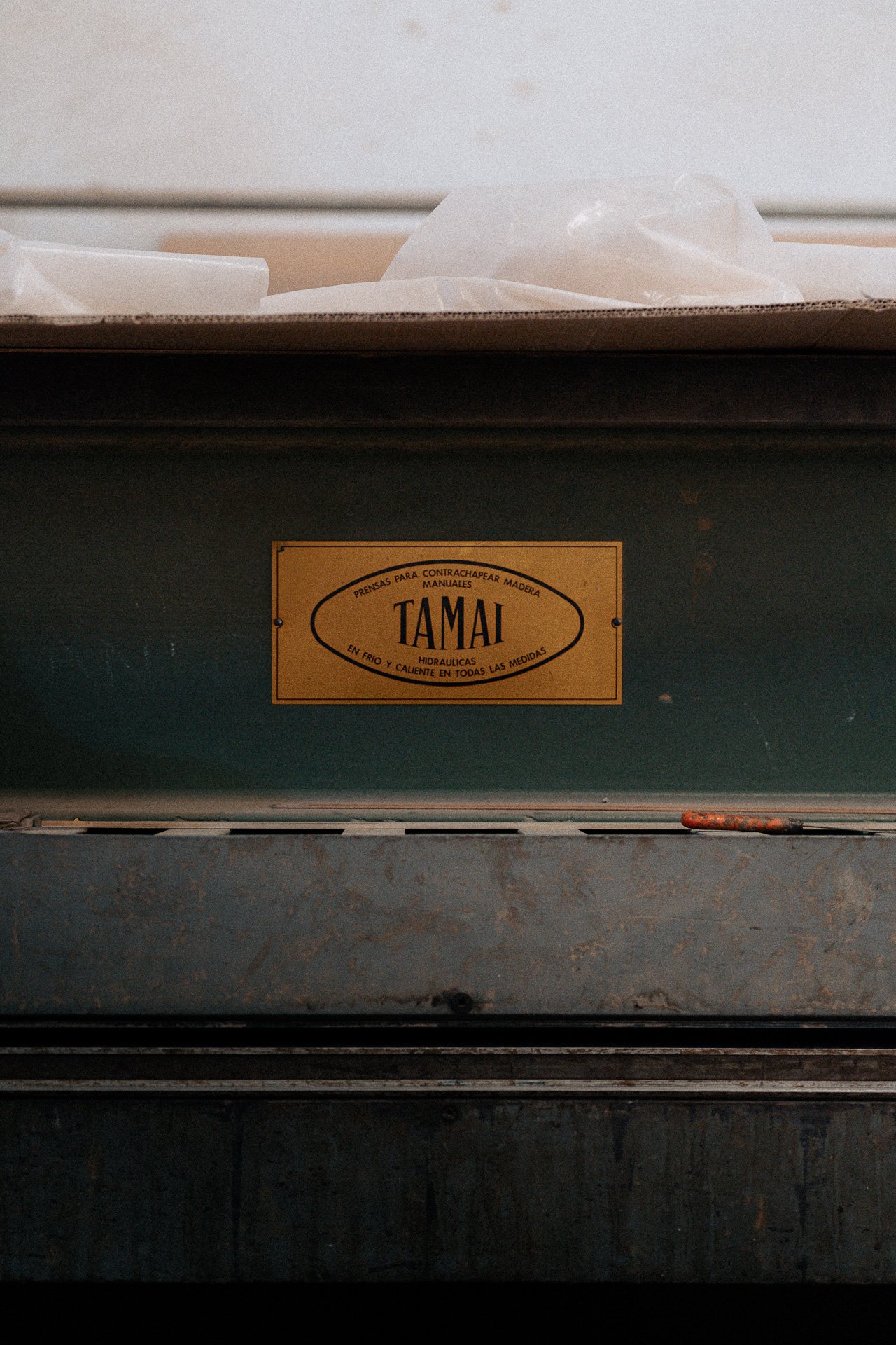 Vintage label on a dark metal surface, minimal product detail for luxury hospitality and restaurant aesthetics