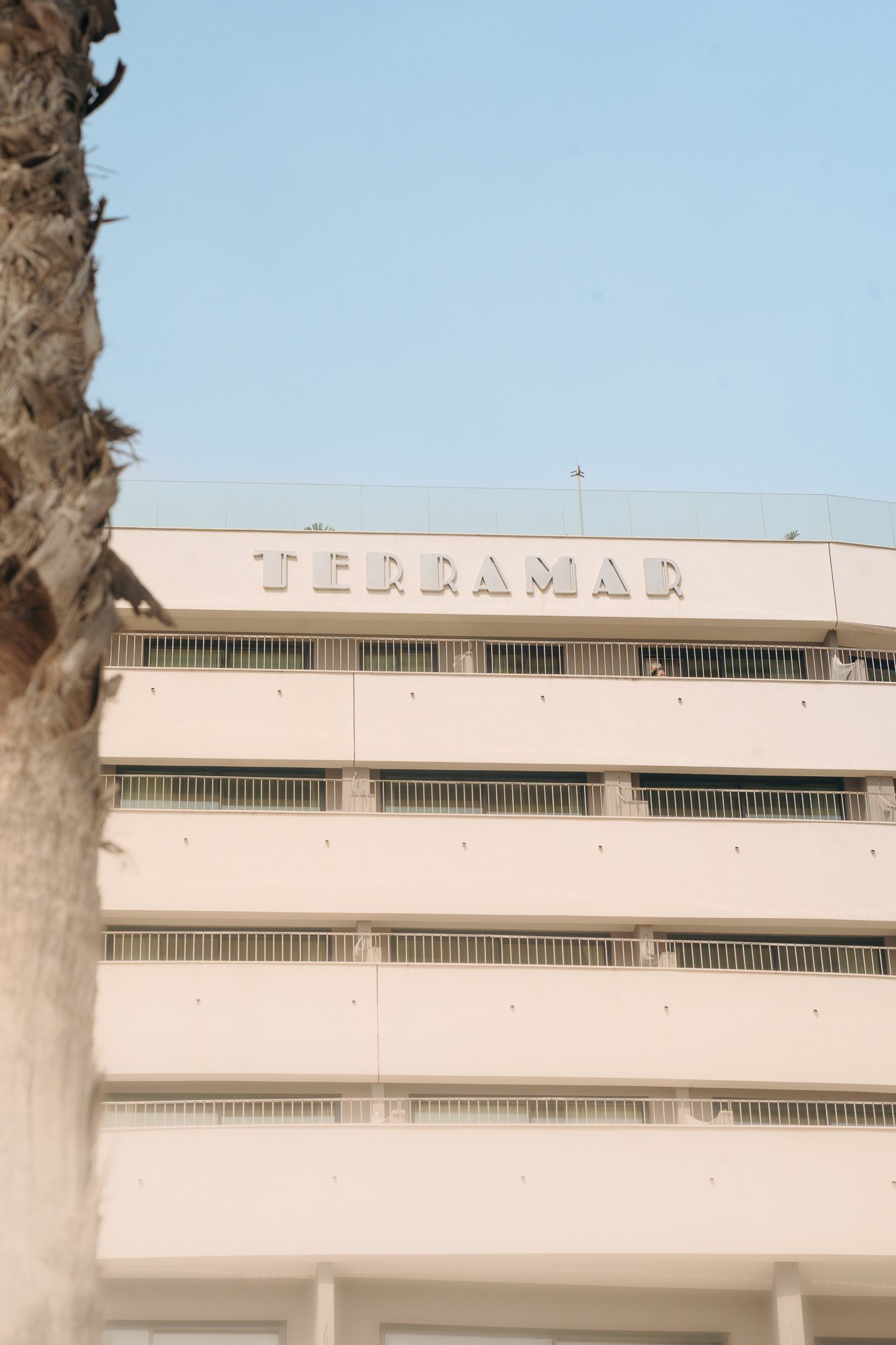 Modernist facade with signage, minimal architecture detail for luxury hospitality and design-focused stays for  Melia Group Hotel ME Sitges